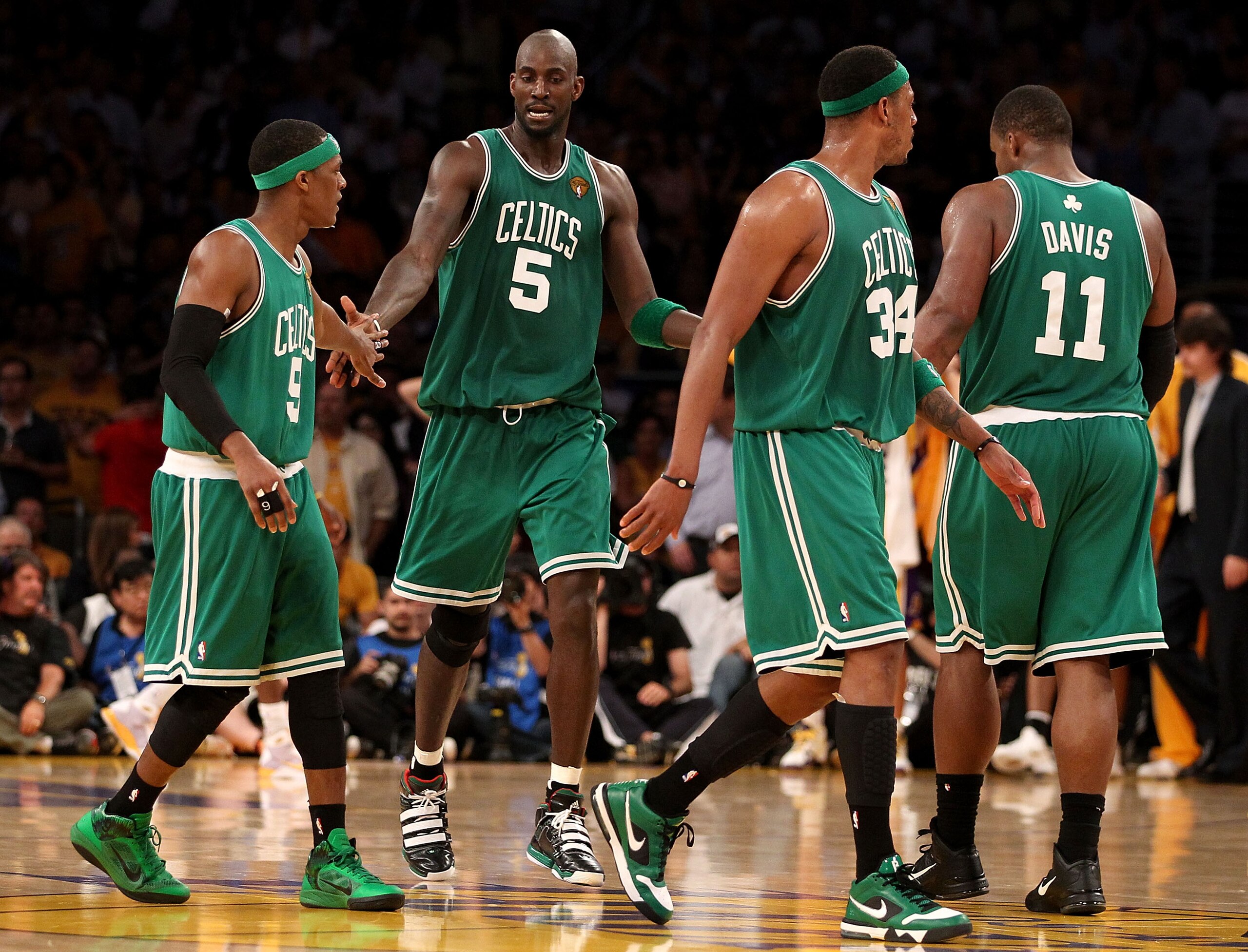 LOS ANGELES, CA - JUNE 17:  (L-R) Rajon Rondo #9, Kevin Garnett #5, Paul Pierce #34 and Glen Davis #11 of the Boston Celtics walk across the court in the second half against the Los Angeles Lakers in Game Seven of the 2010 NBA Finals at Staples Center on