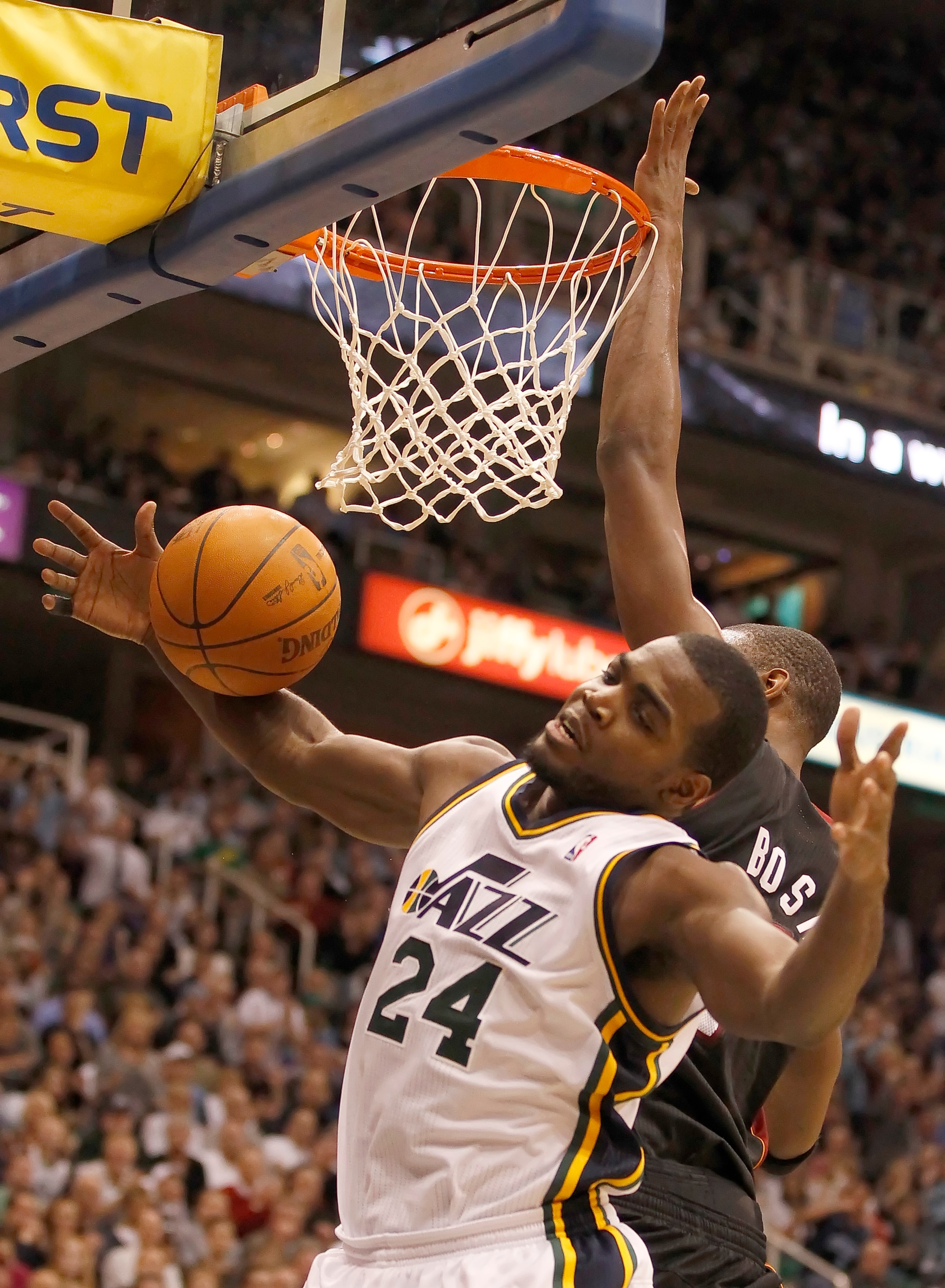 SALT LAKE CITY, UT - DECEMBER 8:  Paul Millsap #24 of the Utah Jazz is fouled by Chris Bosh #1 of the Miami Heat during the second half of an NBA game December 8, 2010 at Energy Solutions Arena in Salt Lake City, Utah. The Heat beat the Jazz 111-98. NOTE