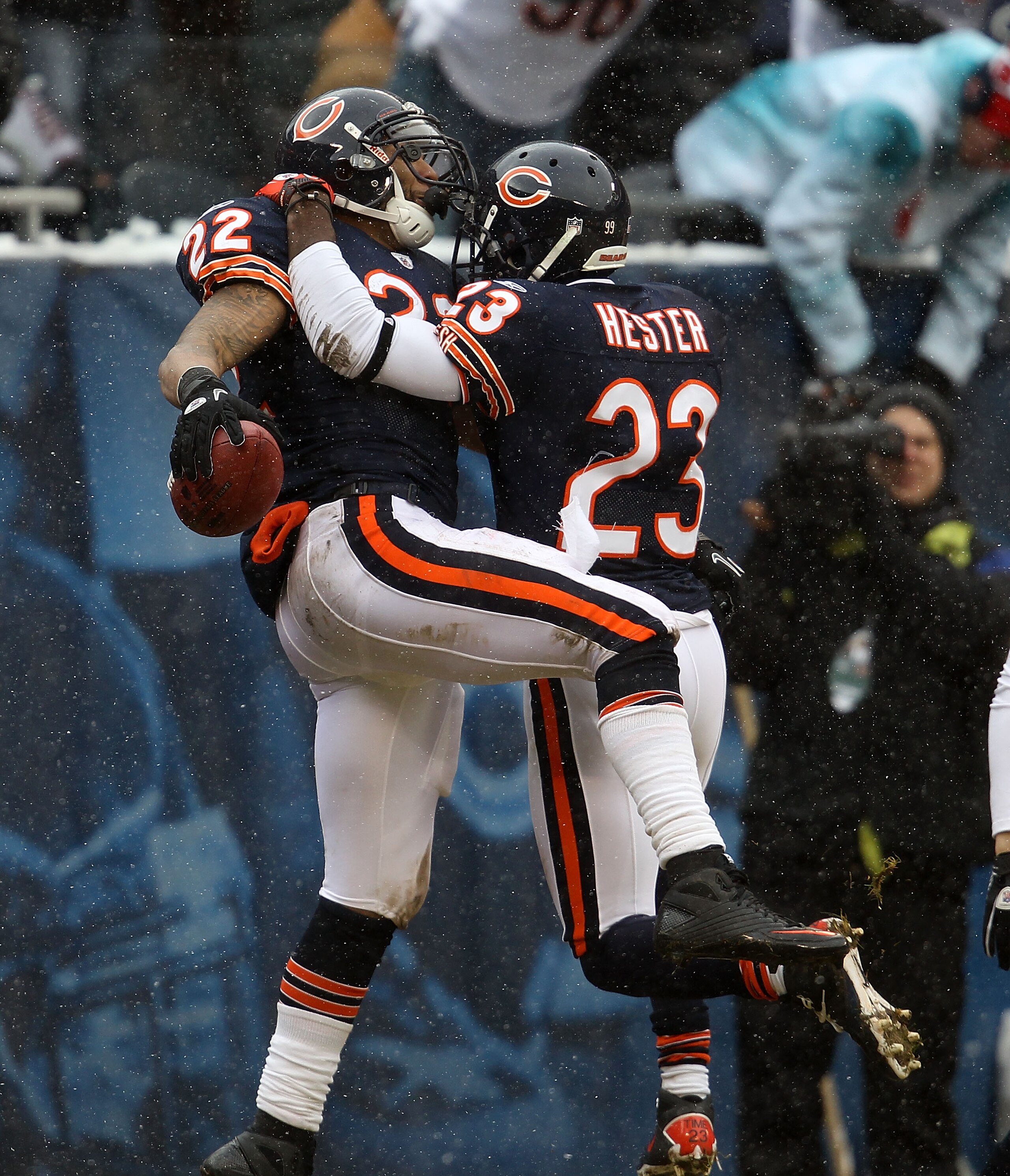 CHICAGO, IL - DECEMBER 26: Matt Forte #22 of the Chicago Bears is greeted by teammate Devin Hester #23 after scoring a touchdown against the New York Jets at Soldier Field on December 26, 2010 in Chicago, Illinois. The Bears defeated the Jets 38-34. (Phot