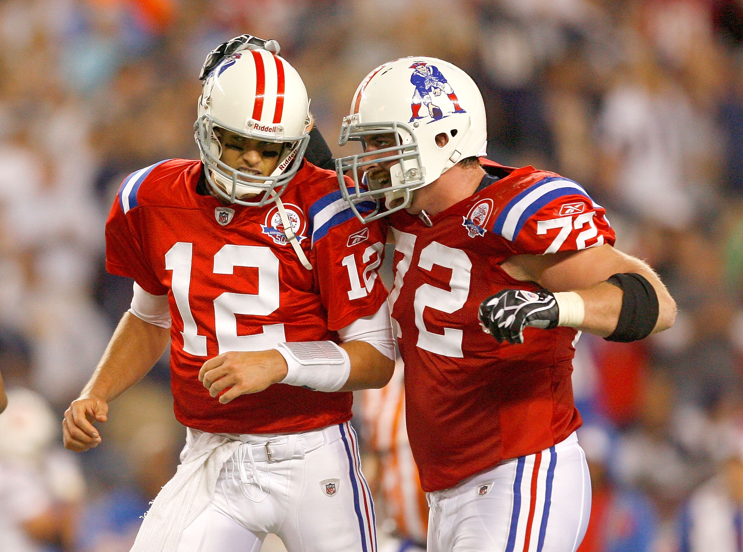 FOXBORO, MA - SEPTEMBER 14:  Tom Brady #12 of the New England Patriots celebrates with teammate Matt Light after a touchdown against the Buffalo Bills at Gillette Stadium on September 14, 2009 in Foxboro, Massachusetts. (Photo by Jim Rogash/Getty Images)
