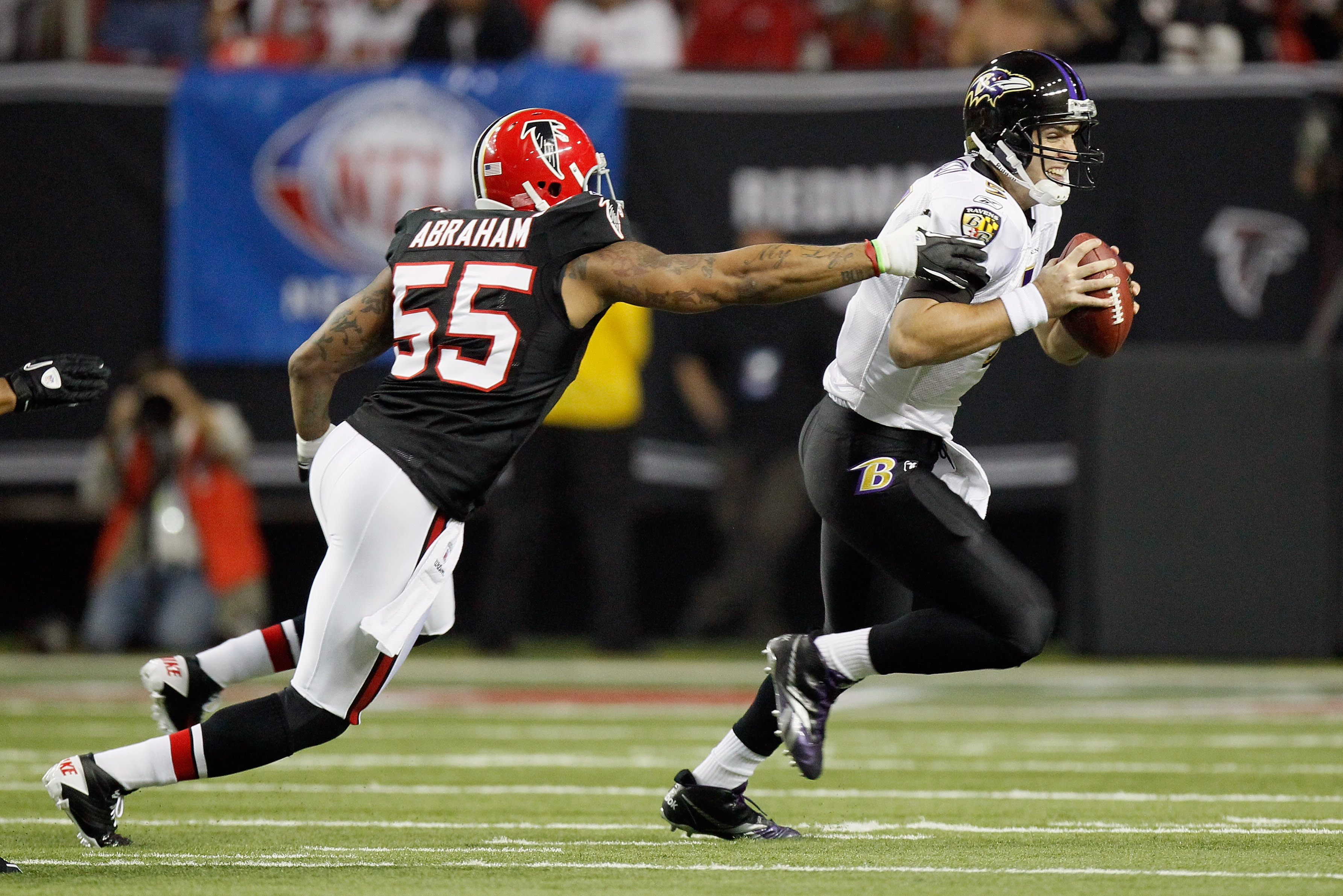 ATLANTA - NOVEMBER 11:  John Abraham #55 of the Atlanta Falcons pressures quarterback Joe Flacco #5 of the Baltimore Ravens at Georgia Dome on November 11, 2010 in Atlanta, Georgia.  (Photo by Kevin C. Cox/Getty Images)