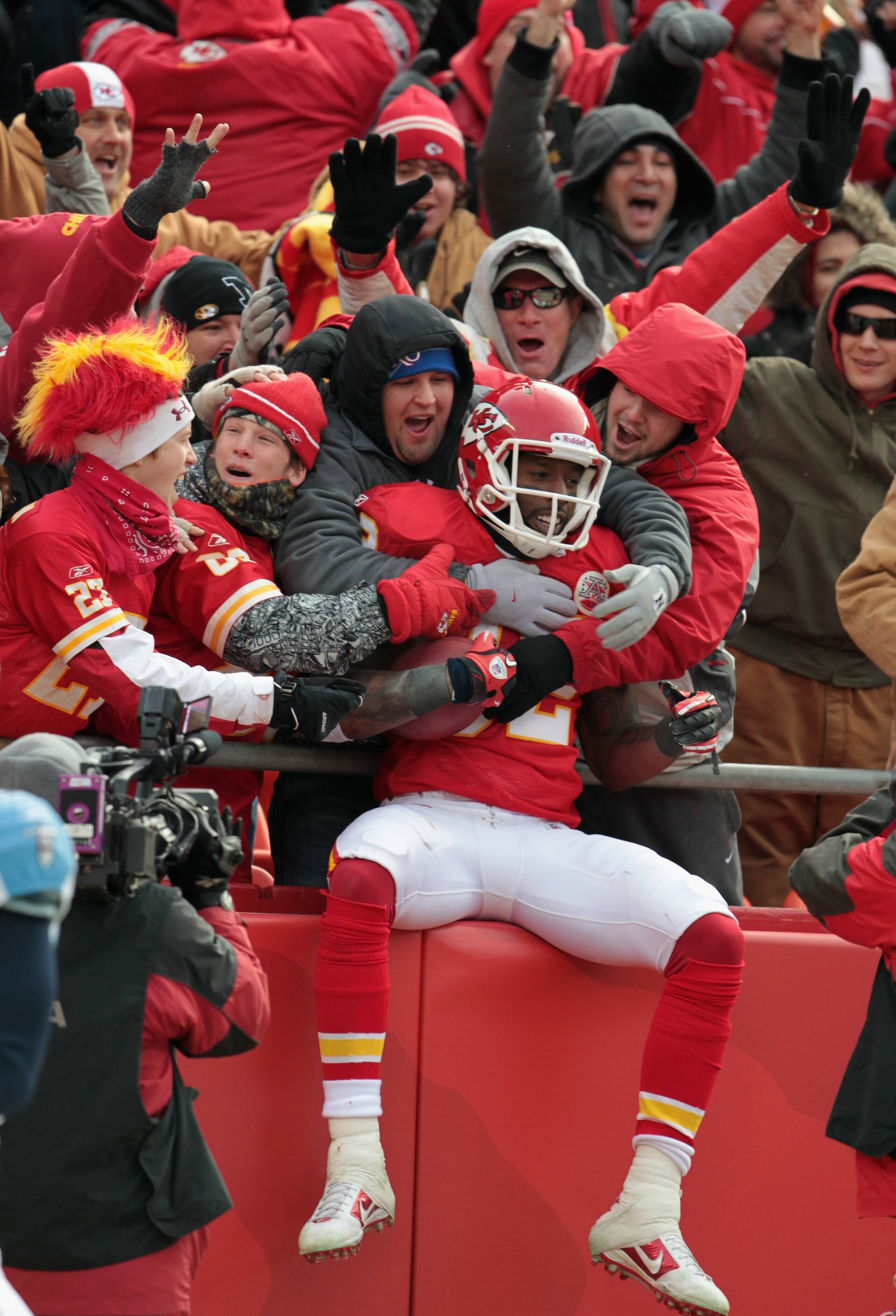 KANSAS CITY, MO - DECEMBER 26: Receiver Dwayne Bowe #82 of the Kansas City Chiefs is congratulated by fans as he jumps into the stands after making a 75 yard touchdown catch during the game against the Tennessee Titans on December 26, 2010 at Arrowhead S KANSAS CITY, MO - DECEMBER 26: Receiver Dwayne Bowe #82 of the Kansas City Chiefs is congratulated by fans as he jumps into the stands after making a 75 yard touchdown catch during the game against the Tennessee Titans on December 26, 2010 at Arrowhead S
