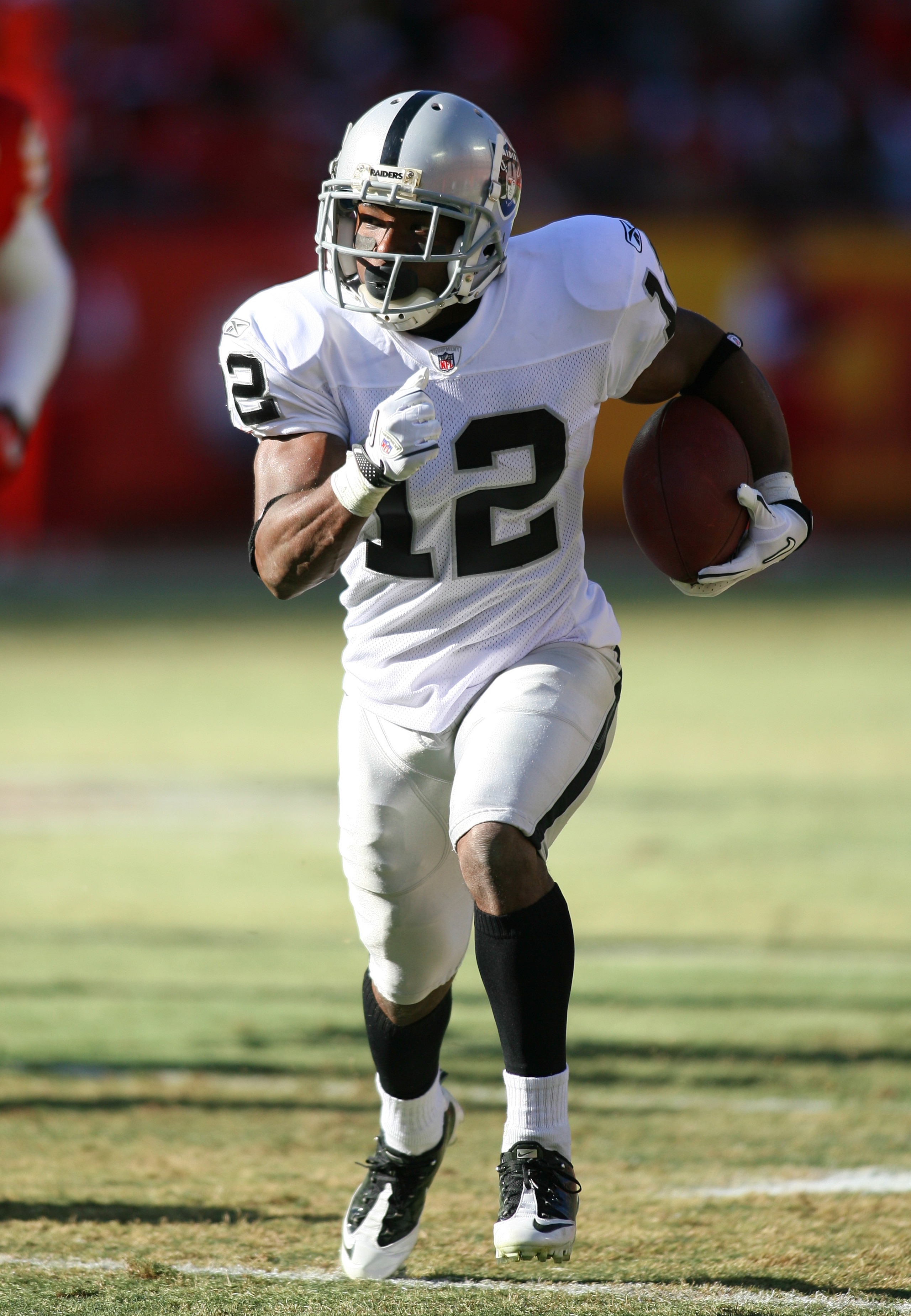 KANSAS CITY, MO - JANUARY 02:  Wide receiver Jacoby Ford #12 of the Oakland Raiders runs down field in a game against the Kansas City Chiefs at Arrowhead Stadium on January 2, 2011 in Kansas City, Missouri.  (Photo by Tim Umphrey/Getty Images)