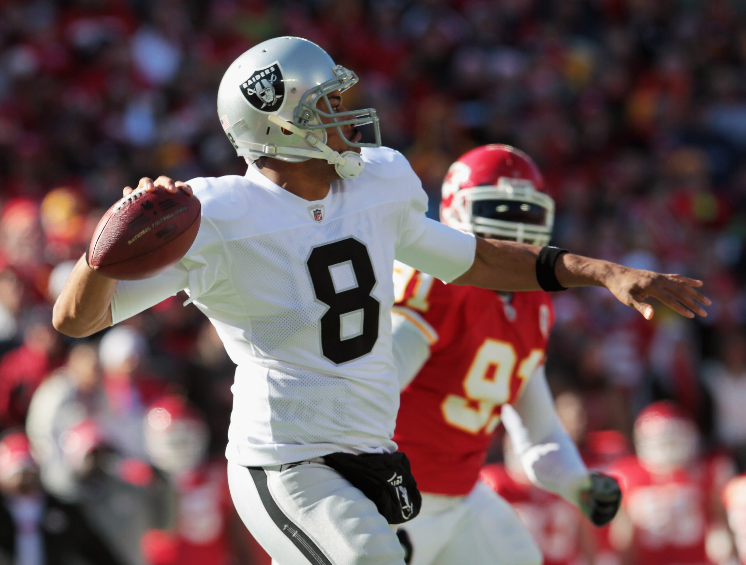 KANSAS CITY, MO - JANUARY 02:  Quarterback Jason Campbell #8 of the Oakland Raiders passes during the game against the Kansas City Chiefs on January 2, 2011 at Arrowhead Stadium in Kansas City, Missouri.  (Photo by Jamie Squire/Getty Images)