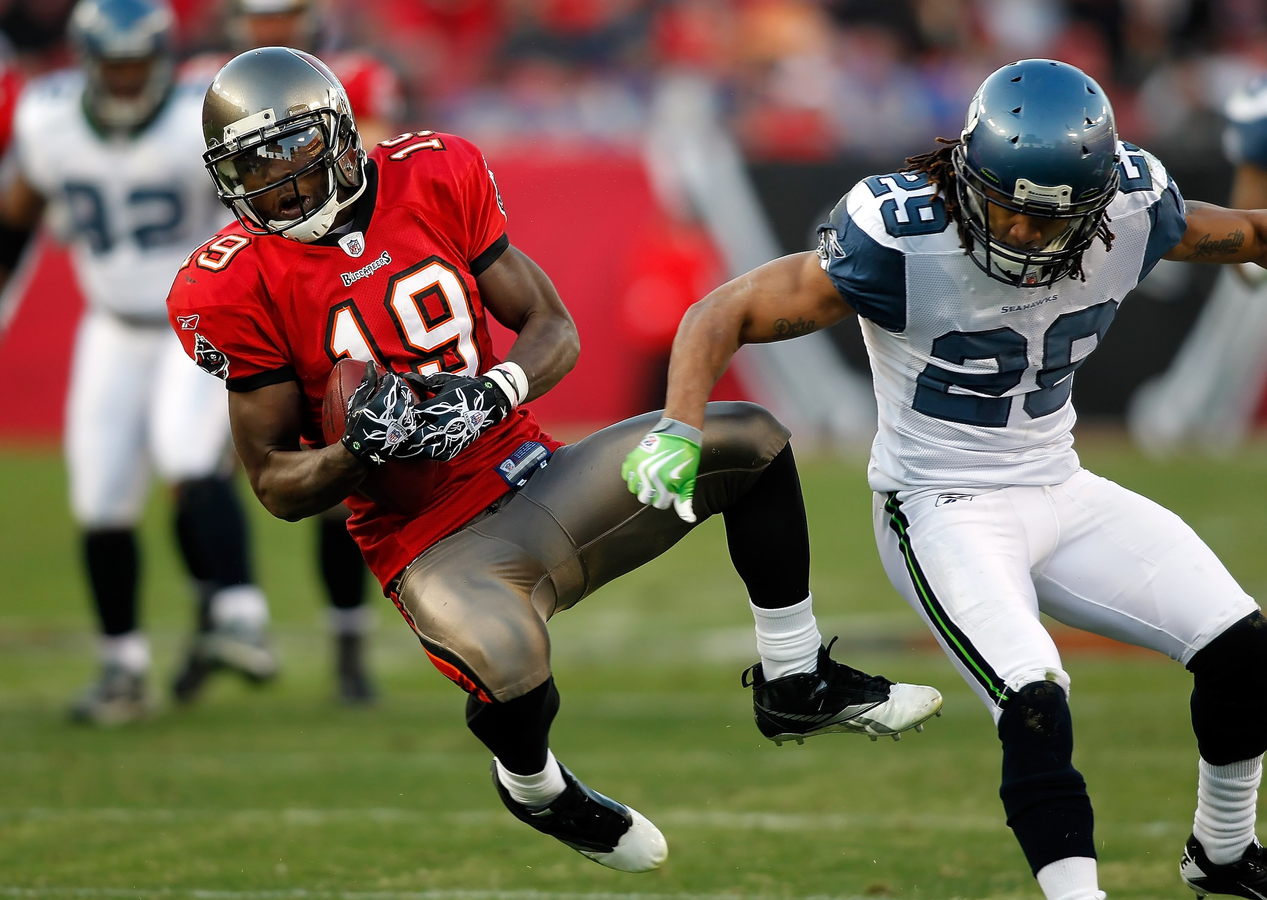 TAMPA, FL - DECEMBER 26: Receiver Mike Williams #19 of the Tampa Bay Buccaneers catches a pass in front of safety Earl Thomas #29 of the Seattle Seahawks during the game at Raymond James Stadium on December 26, 2010 in Tampa, Florida. (Photo by J. Meric/G