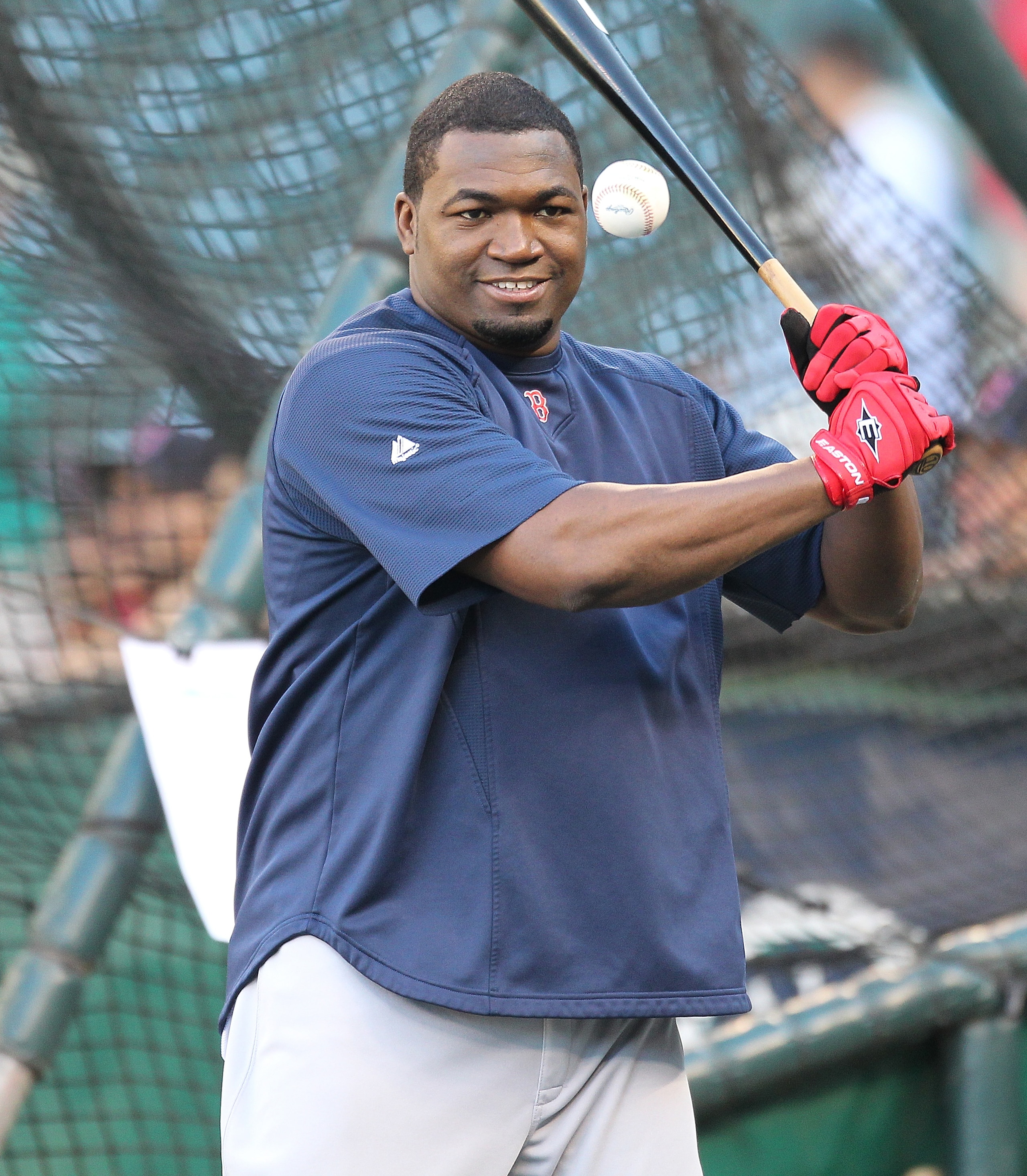 SEATTLE - SEPTEMBER 13:  David Ortiz #34 of the Boston Red Sox hits grounders to teammates taking infield practice between his turns in the cage for batting practice prior to the game against the Seattle Mariners at Safeco Field on September 13, 2010 in S