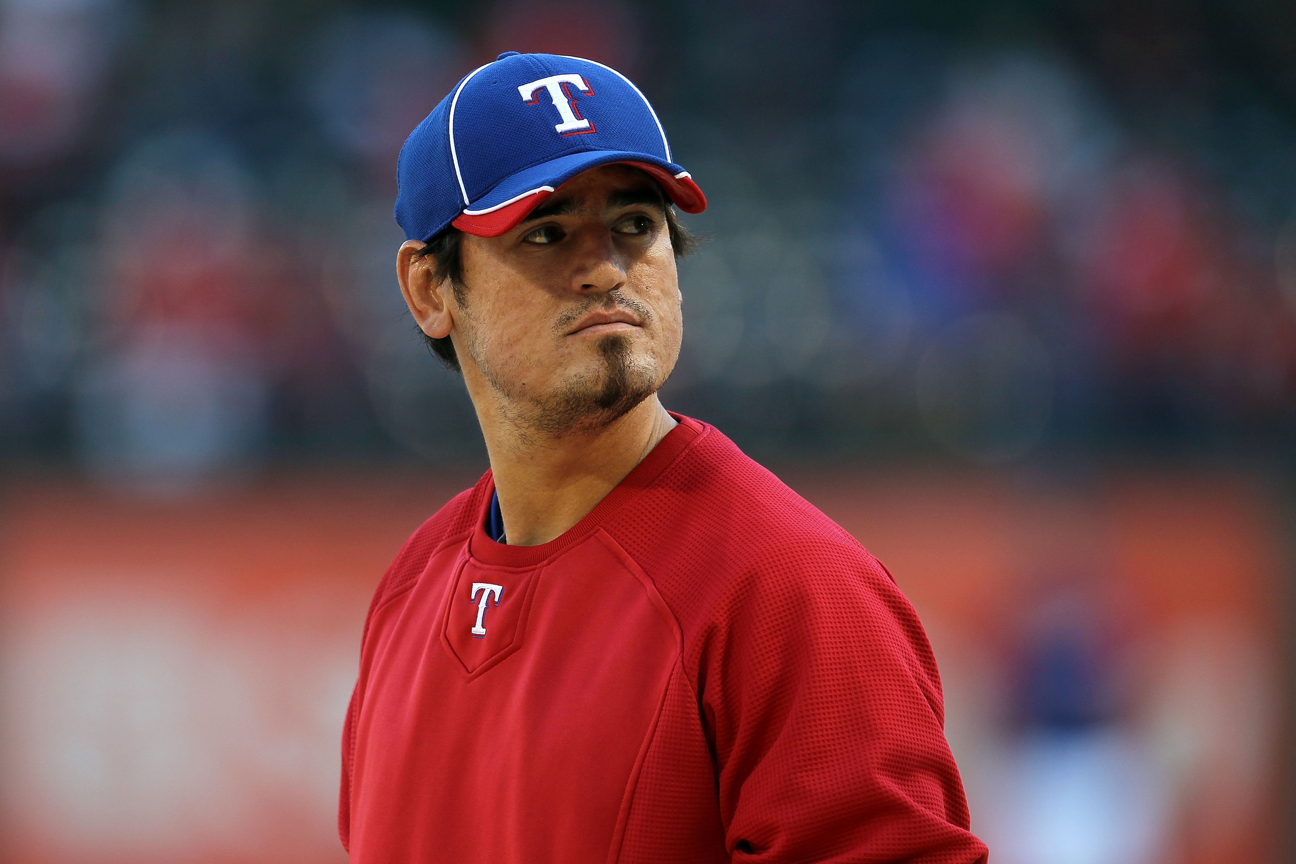 ARLINGTON, TX - OCTOBER 15:  Jorge Cantu #8 of the Texas Rangers looks on during batting practice against the New York Yankees in Game One of the ALCS during the 2010 MLB Playoffs at Rangers Ballpark in Arlington on October 15, 2010 in Arlington, Texas.