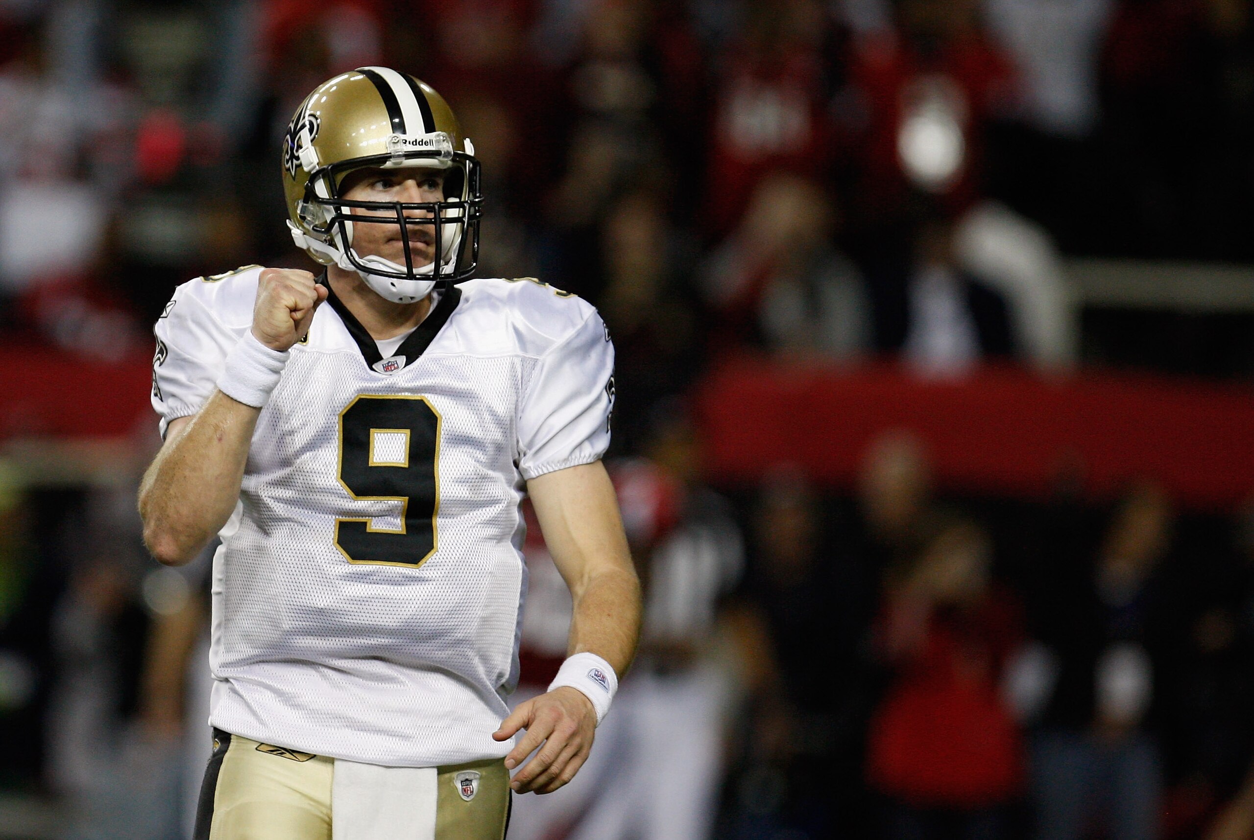 ATLANTA, GA - DECEMBER 27: Quarterback Drew Brees #9 of the New Orleans Saints celebrates a touchdown pass to Jimmy Graham in the second half during the game against the Atlanta Falcons at the Georgia Dome on December 27, 2010 in Atlanta, Georgia. (Phot ATLANTA, GA - DECEMBER 27: Quarterback Drew Brees #9 of the New Orleans Saints celebrates a touchdown pass to Jimmy Graham in the second half during the game against the Atlanta Falcons at the Georgia Dome on December 27, 2010 in Atlanta, Georgia. (Phot