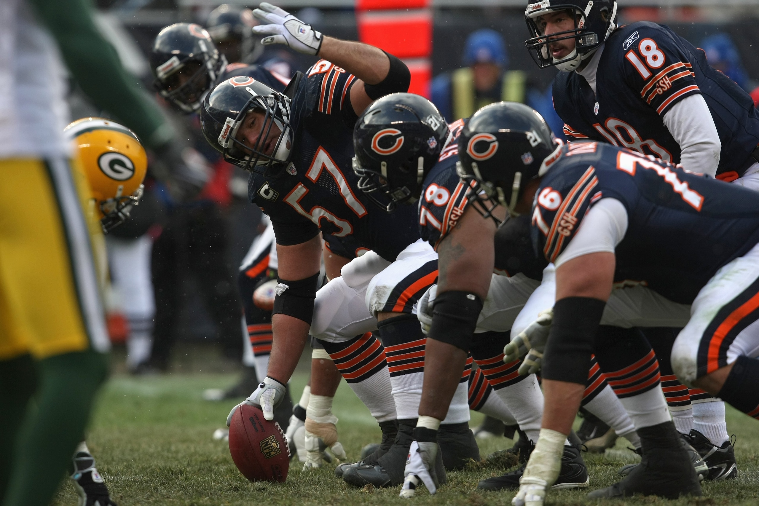 CHICAGO - DECEMBER 23: Olin Kruetz #57 of the Chicago Bears readies to make the snap against the Green Bay Packers on December 23, 2007 at Soldier Field in Chicago, Illinois. (Photo by Jonathan Daniel/Getty Images)