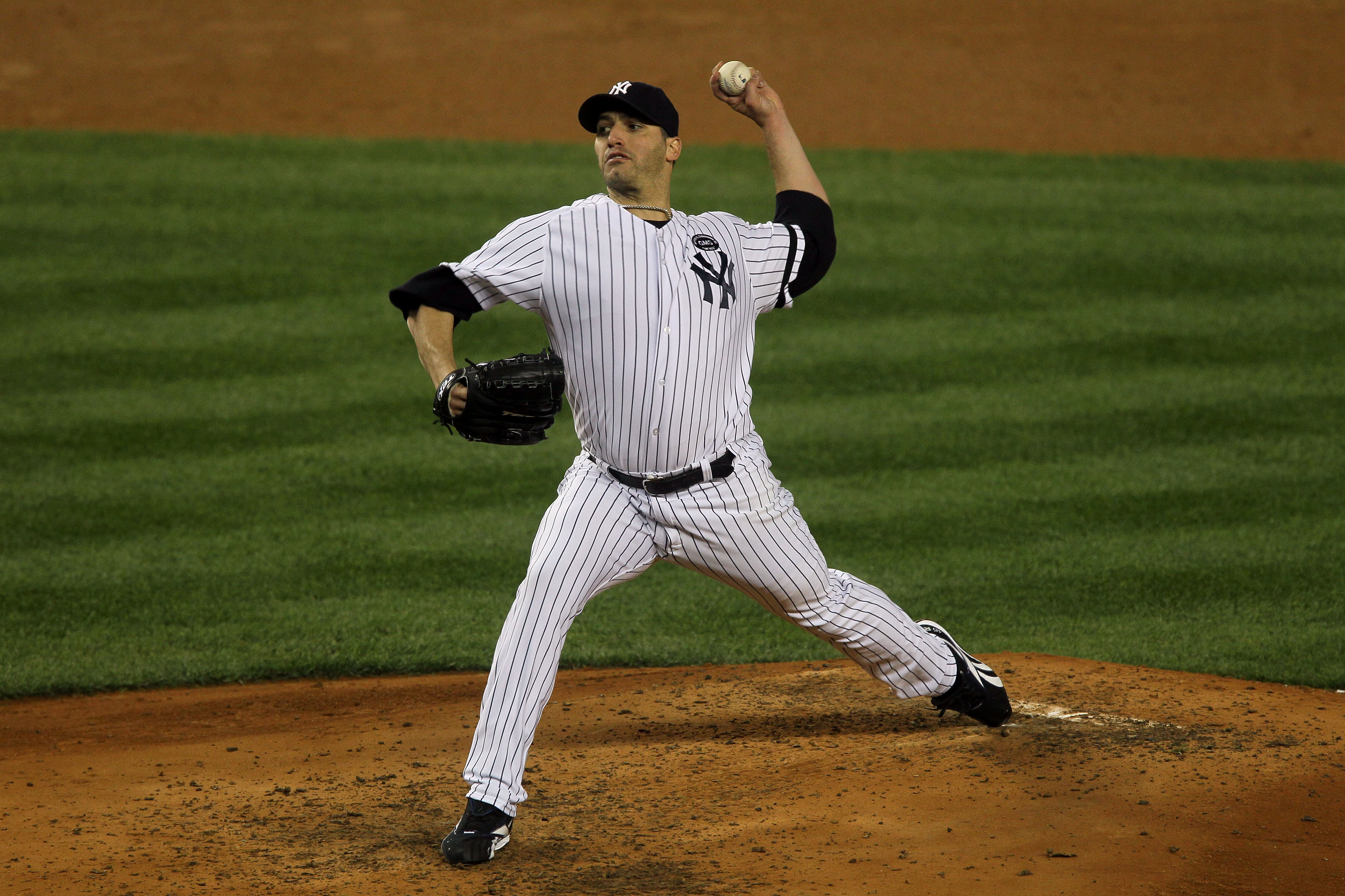 NEW YORK - OCTOBER 18:  Starting pitcher Andy Pettitte #46 of the New York Yankees pitches against the Texas Rangers in Game Three of the ALCS during the 2010 MLB Playoffs at Yankee Stadium on October 18, 2010 in New York, New York. The Raners won 8-0.  (