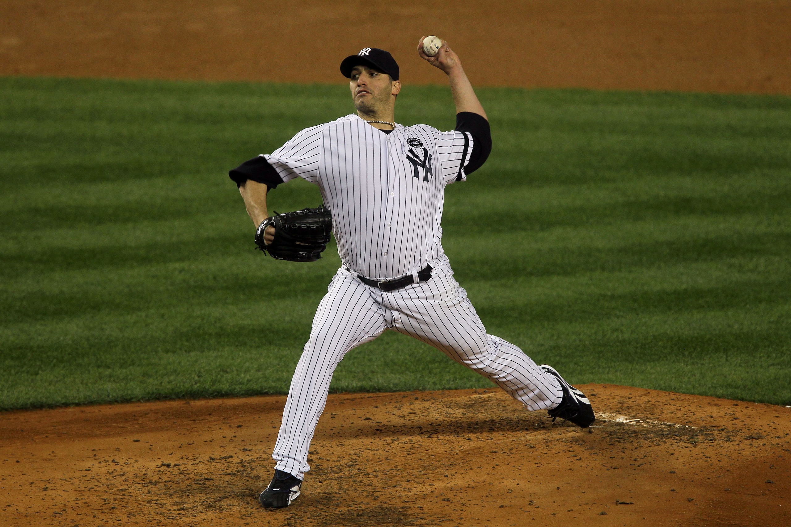 NEW YORK - OCTOBER 18: Starting pitcher Andy Pettitte #46 of the New York Yankees pitches against the Texas Rangers in Game Three of the ALCS during the 2010 MLB Playoffs at Yankee Stadium on October 18, 2010 in New York, New York. The Raners won 8-0. ( NEW YORK - OCTOBER 18: Starting pitcher Andy Pettitte #46 of the New York Yankees pitches against the Texas Rangers in Game Three of the ALCS during the 2010 MLB Playoffs at Yankee Stadium on October 18, 2010 in New York, New York. The Raners won 8-0. (
