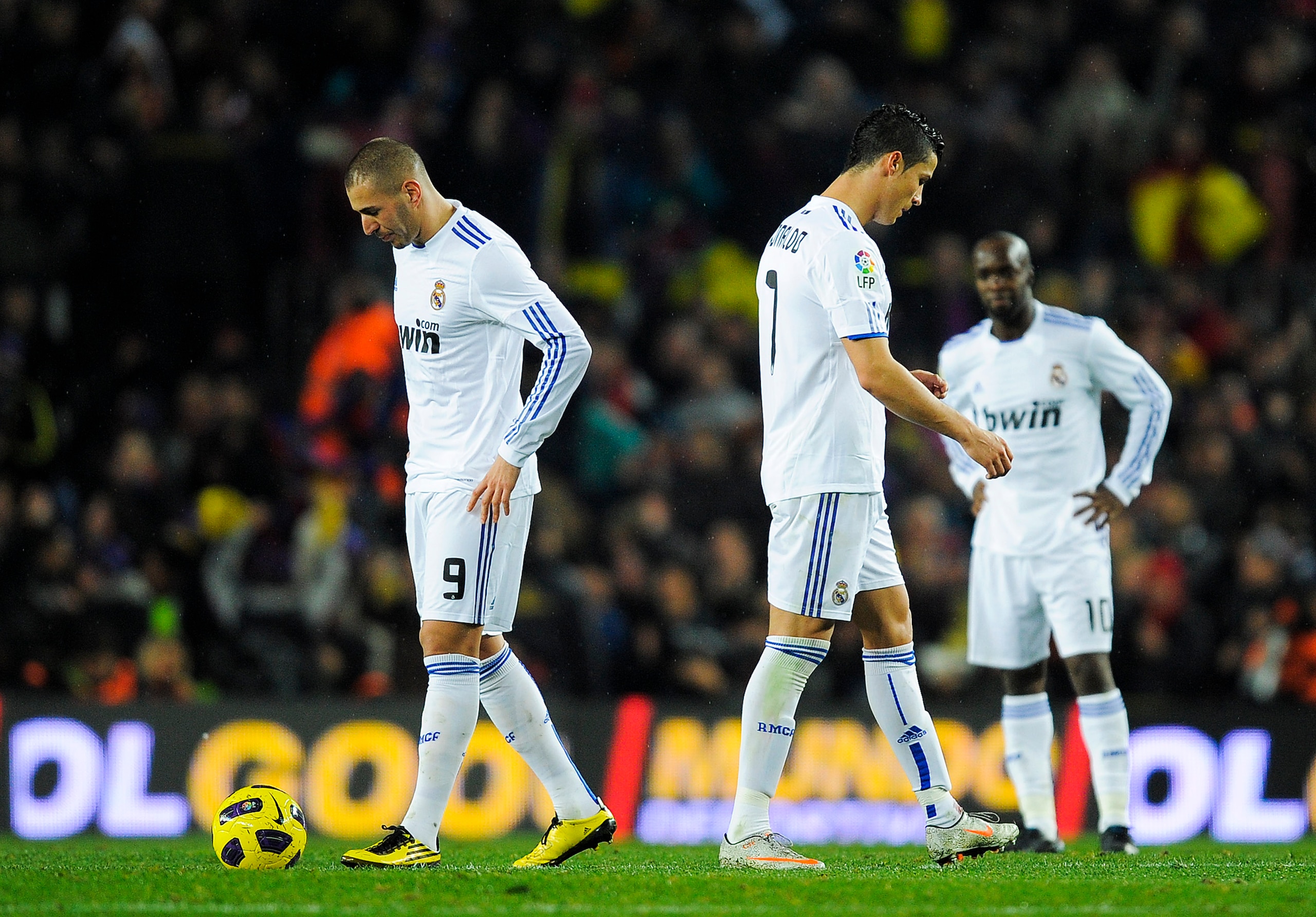 BARCELONA, SPAIN - NOVEMBER 29: Karim Benzema and Cristiano Ronaldo of Real Madrid react after David Villa scored his second goal to make the score 4-0 in Barcelona's favour during the La Liga match between Barcelona and Real Madrid at the Camp Nou Stadi BARCELONA, SPAIN - NOVEMBER 29: Karim Benzema and Cristiano Ronaldo of Real Madrid react after David Villa scored his second goal to make the score 4-0 in Barcelona's favour during the La Liga match between Barcelona and Real Madrid at the Camp Nou Stadi