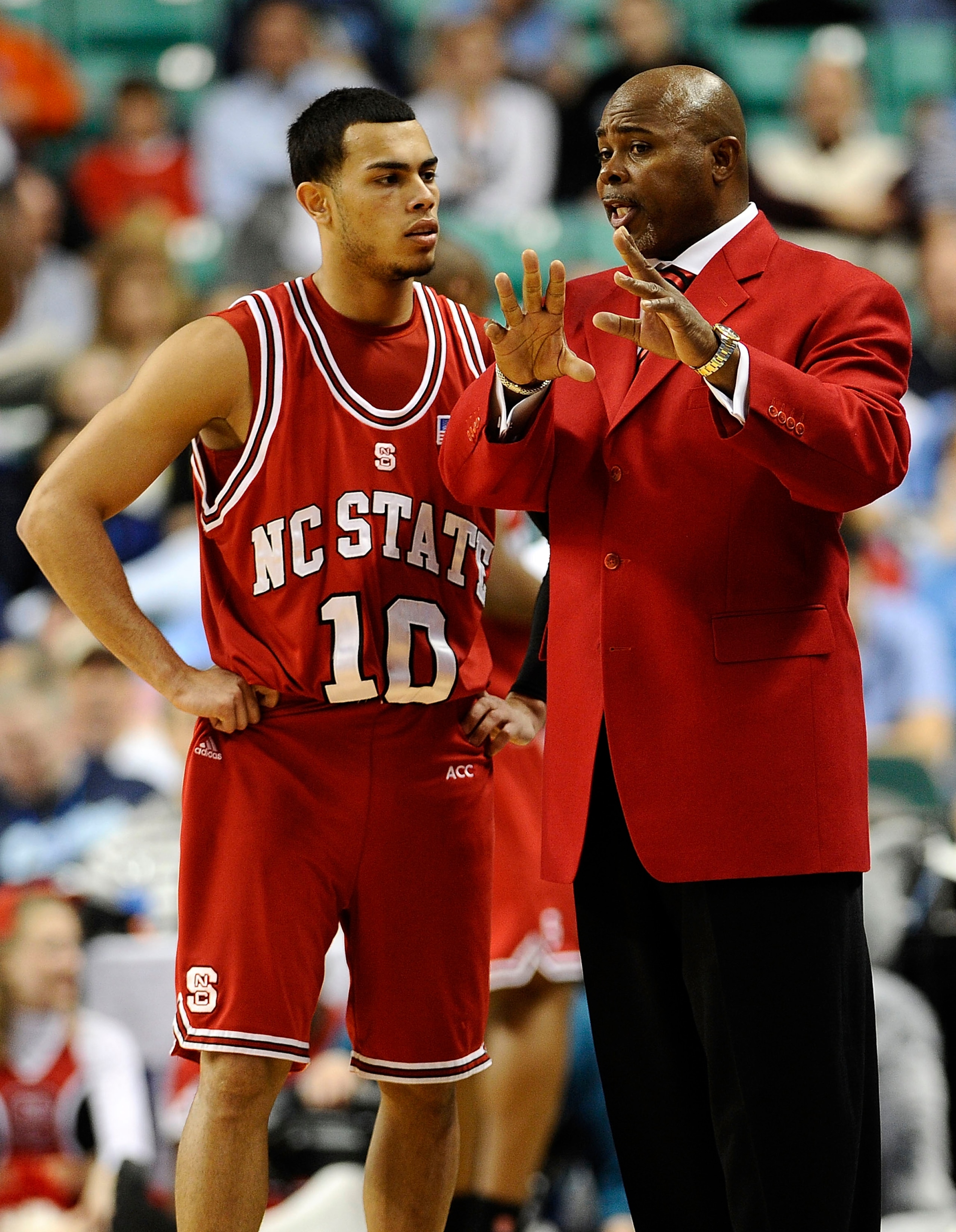 GREENSBORO, NC - MARCH 11: Javier Gonzalez  #10 confers with head coach Sidney Lowe of the Clemson Tigers during their game against the NC State Wolfpack in the first round in the 2010 ACC Men's Basketball Tournament at the Greensboro Coliseum on March 11
