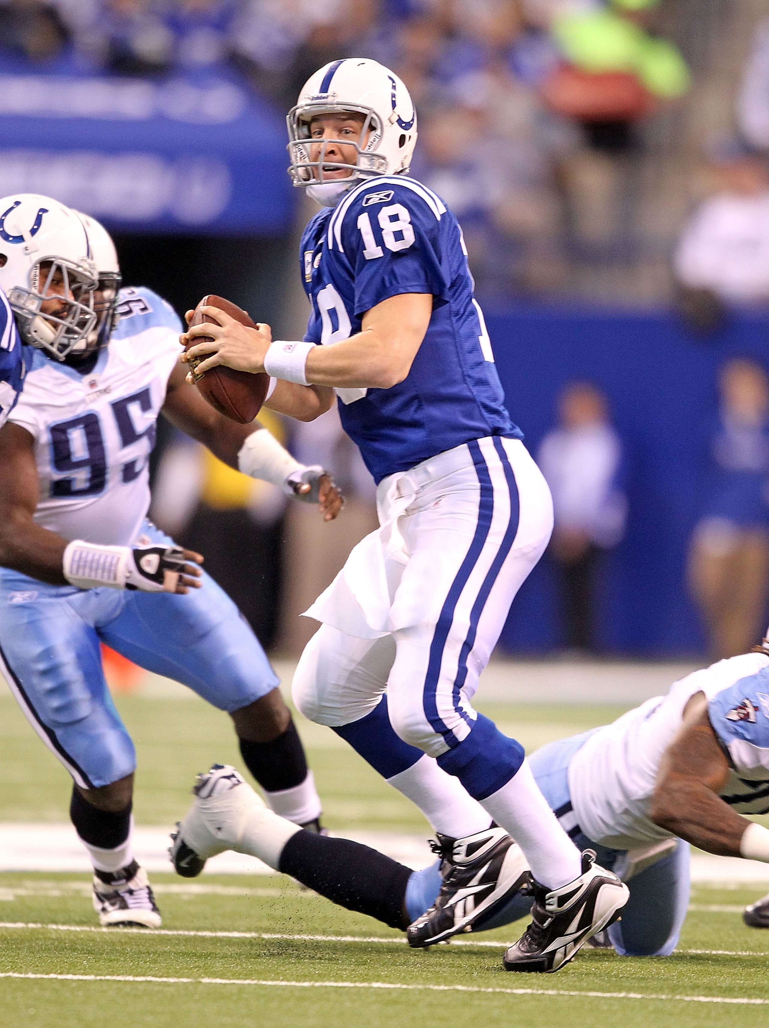 INDIANAPOLIS - JANUARY 02:  Peyton Manning #18 of the Indianapolis Colts looks to pass the ball during NFL game against the Tennessee Titans at Lucas Oil Stadium on January 2, 2011 in Indianapolis, Indiana.  (Photo by Andy Lyons/Getty Images)
