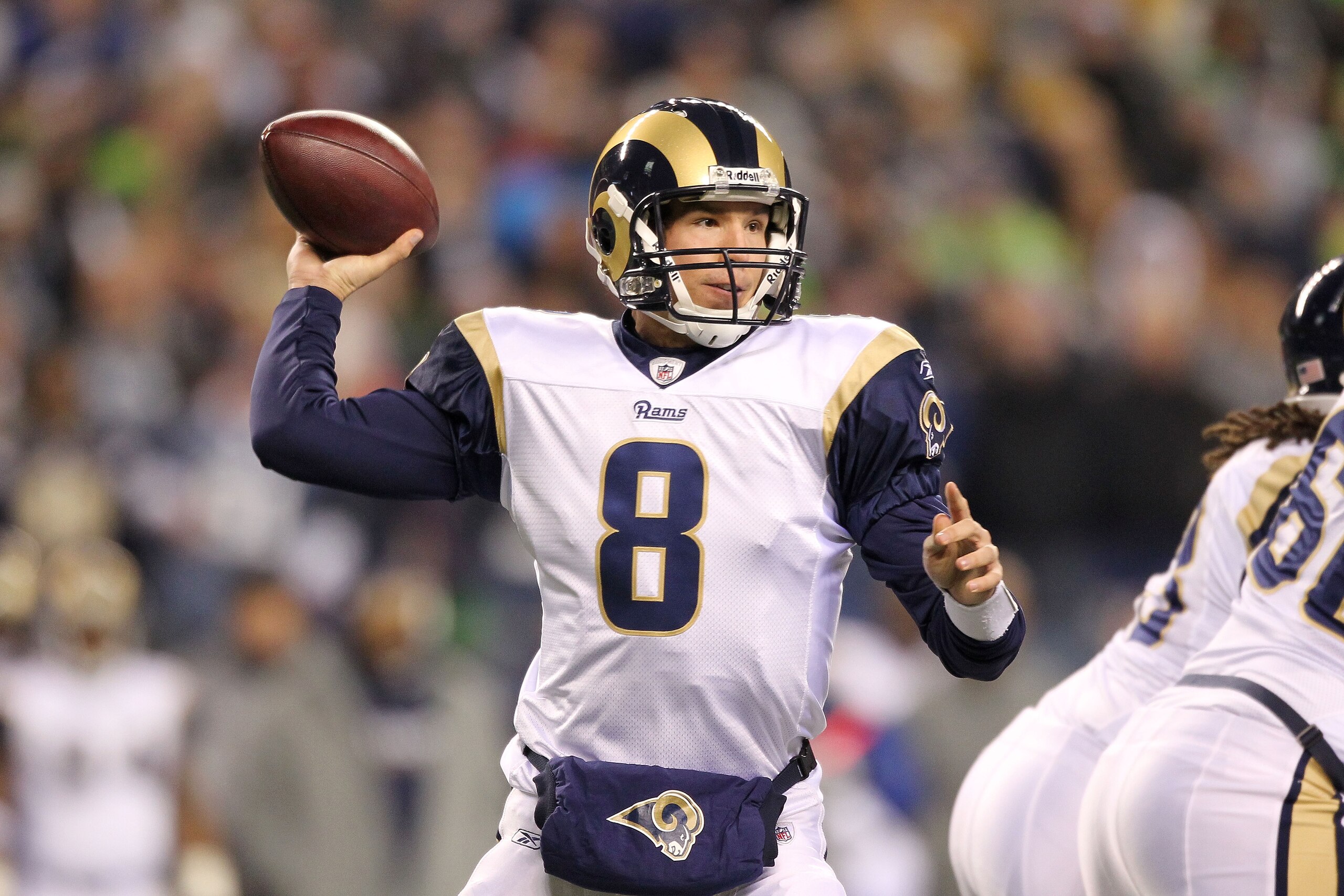 SEATTLE, WA - JANUARY 02:  Quarterback Sam Bradford #8 of the St. Louis Rams looks to pass against the Seattle Seahawks during their game at Qwest Field on January 2, 2011 in Seattle, Washington.  (Photo by Otto Greule Jr/Getty Images)
