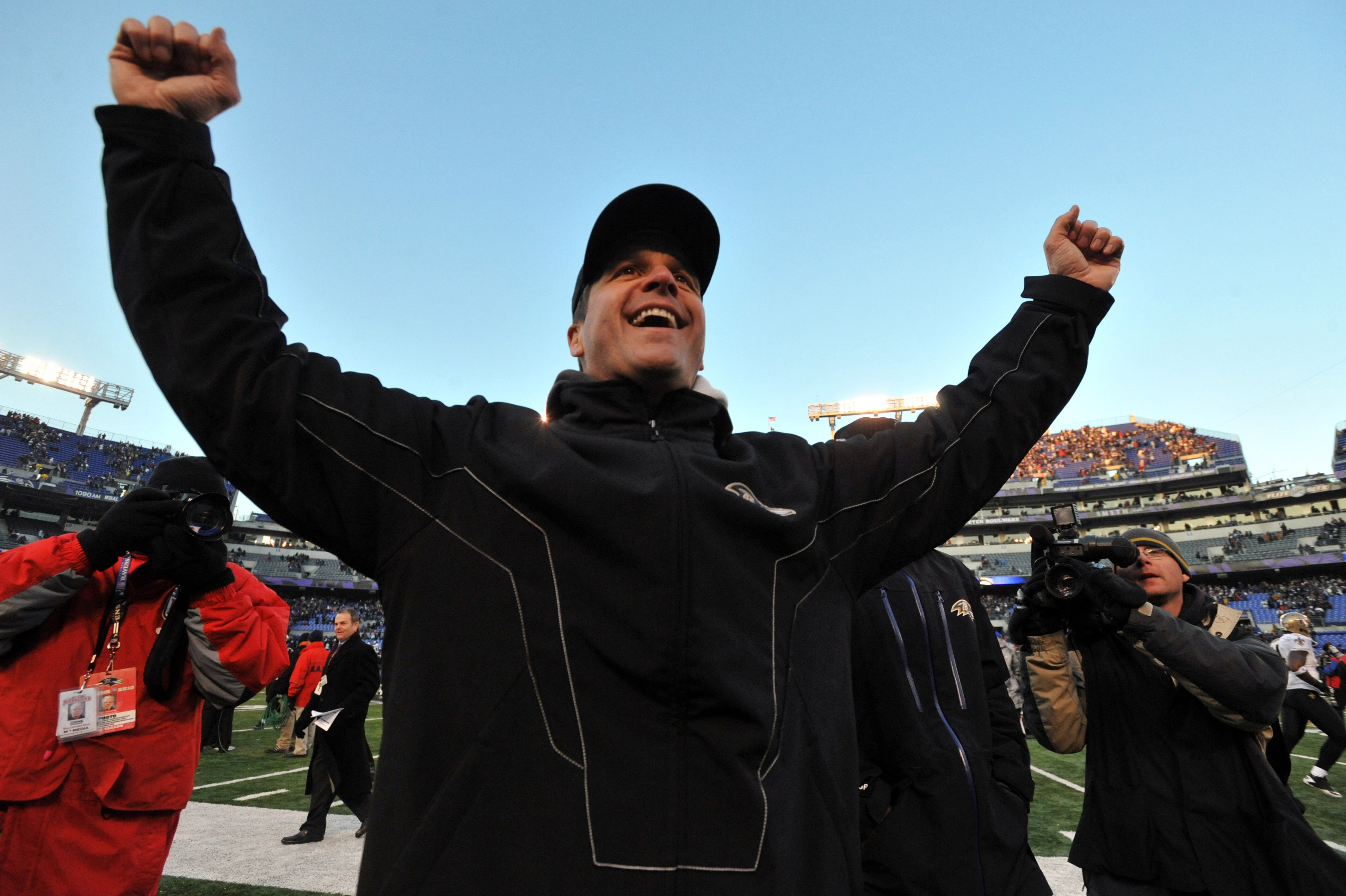 BALTIMORE, MD - DECEMBER 19:  Head coach John Harbaugh of the Baltimore Ravens celebrates the Ravens victory as he walks off the field after the game against the New Orleans Saints  at M&T Bank Stadium on December 19, 2010 in Baltimore, Maryland. The Rave