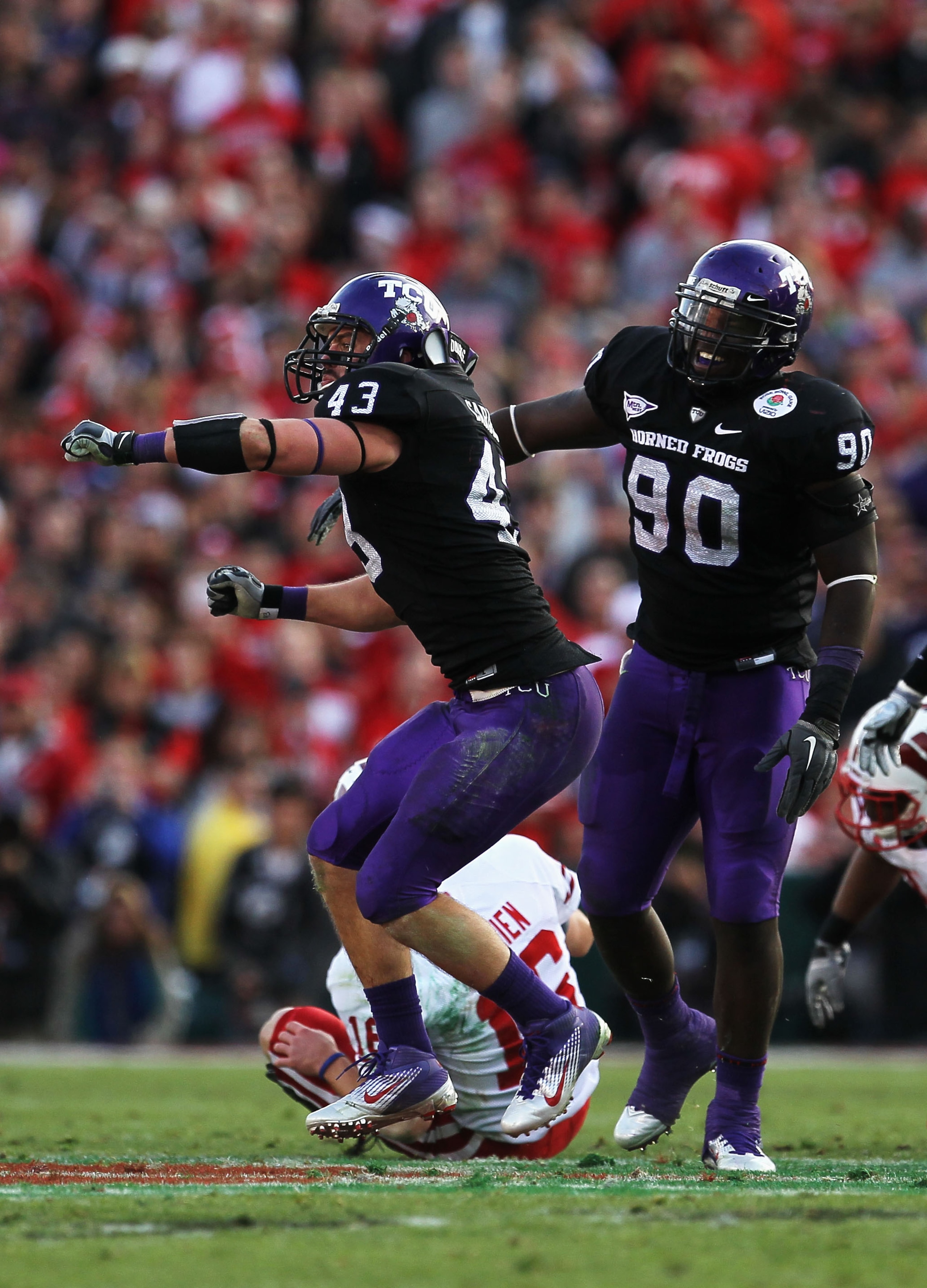PASADENA, CA - JANUARY 01:  Linebacker Tank Carder #43 of the TCU Horned Frogs celebrates after a sack of quarterback Scott Tolzien #16 of the Wisconsin Badgers during the 97th Rose Bowl game on January 1, 2011 in Pasadena, California.  (Photo by Stephen 