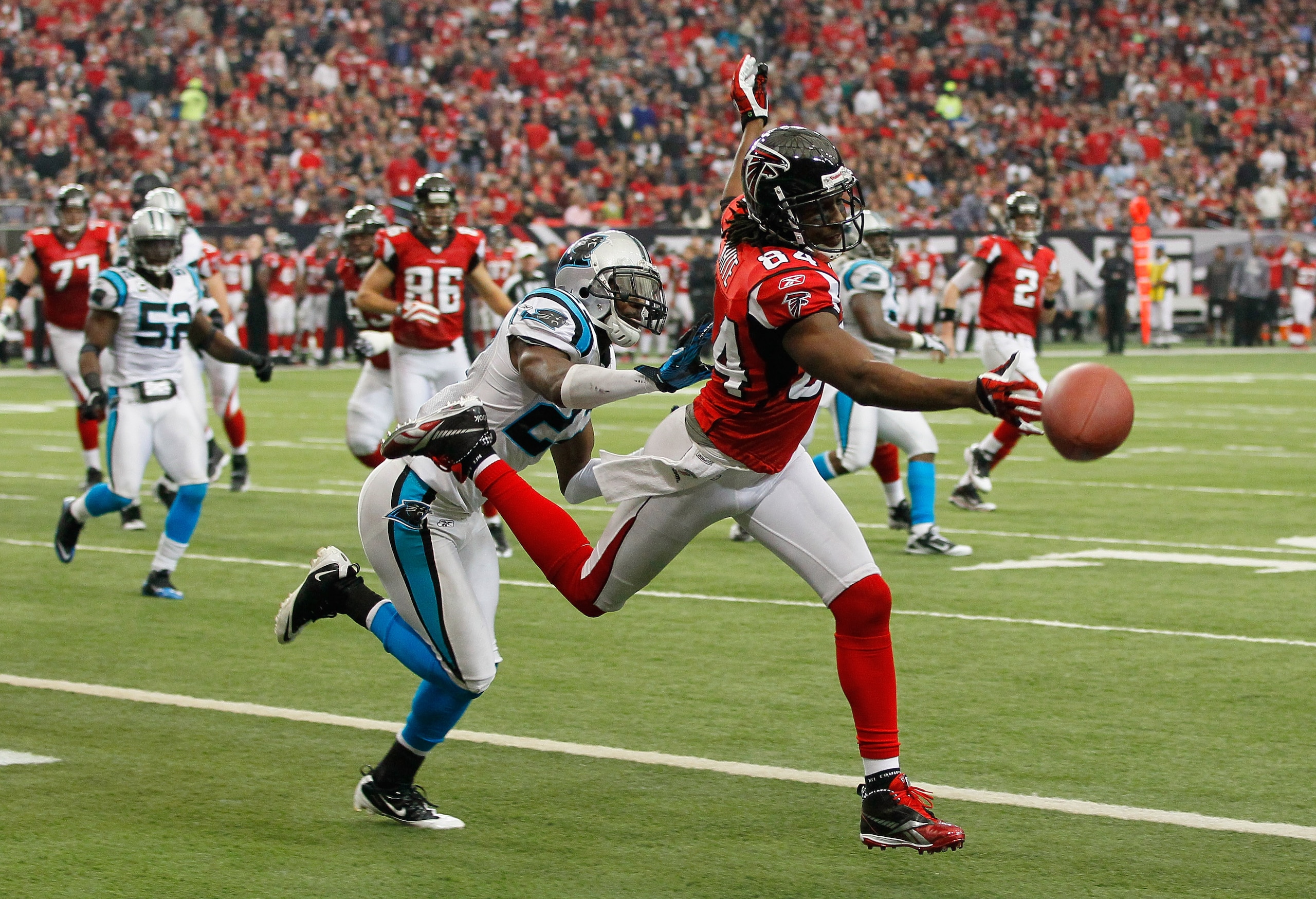 ATLANTA, GA - JANUARY 02:  Roddy White #84 of the Atlanta Falcons fails to pull in this reception against C.J. Wilson #27 of the Carolina Panthers at Georgia Dome on January 2, 2011 in Atlanta, Georgia.  (Photo by Kevin C. Cox/Getty Images)