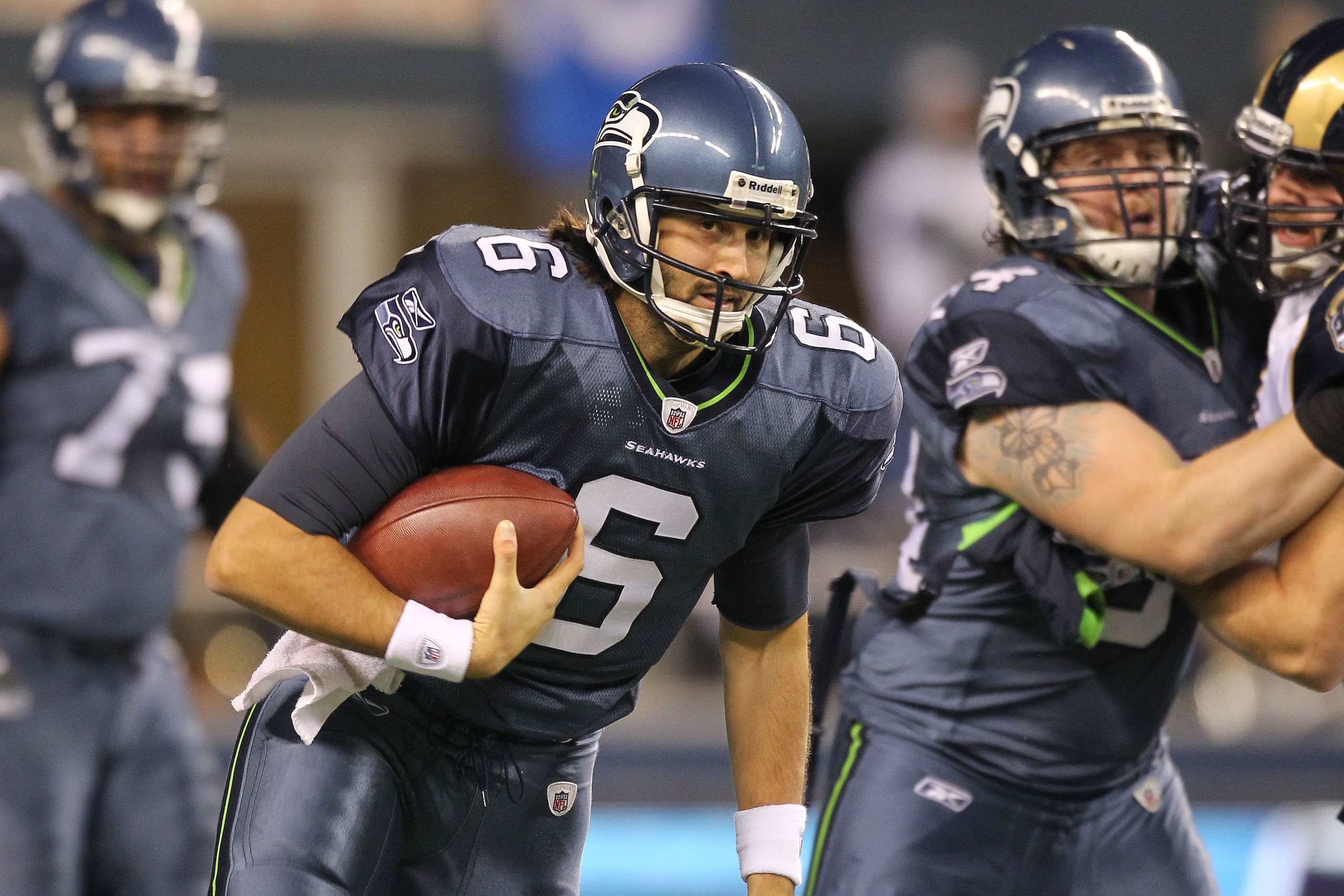 SEATTLE, WA - JANUARY 02:  Quarterback Charlie Whitehurst #6 of the Seattle Seahawks runs with the ball during their game against the St. Louis Rams at Qwest Field on January 2, 2011 in Seattle, Washington.  (Photo by Otto Greule Jr/Getty Images)