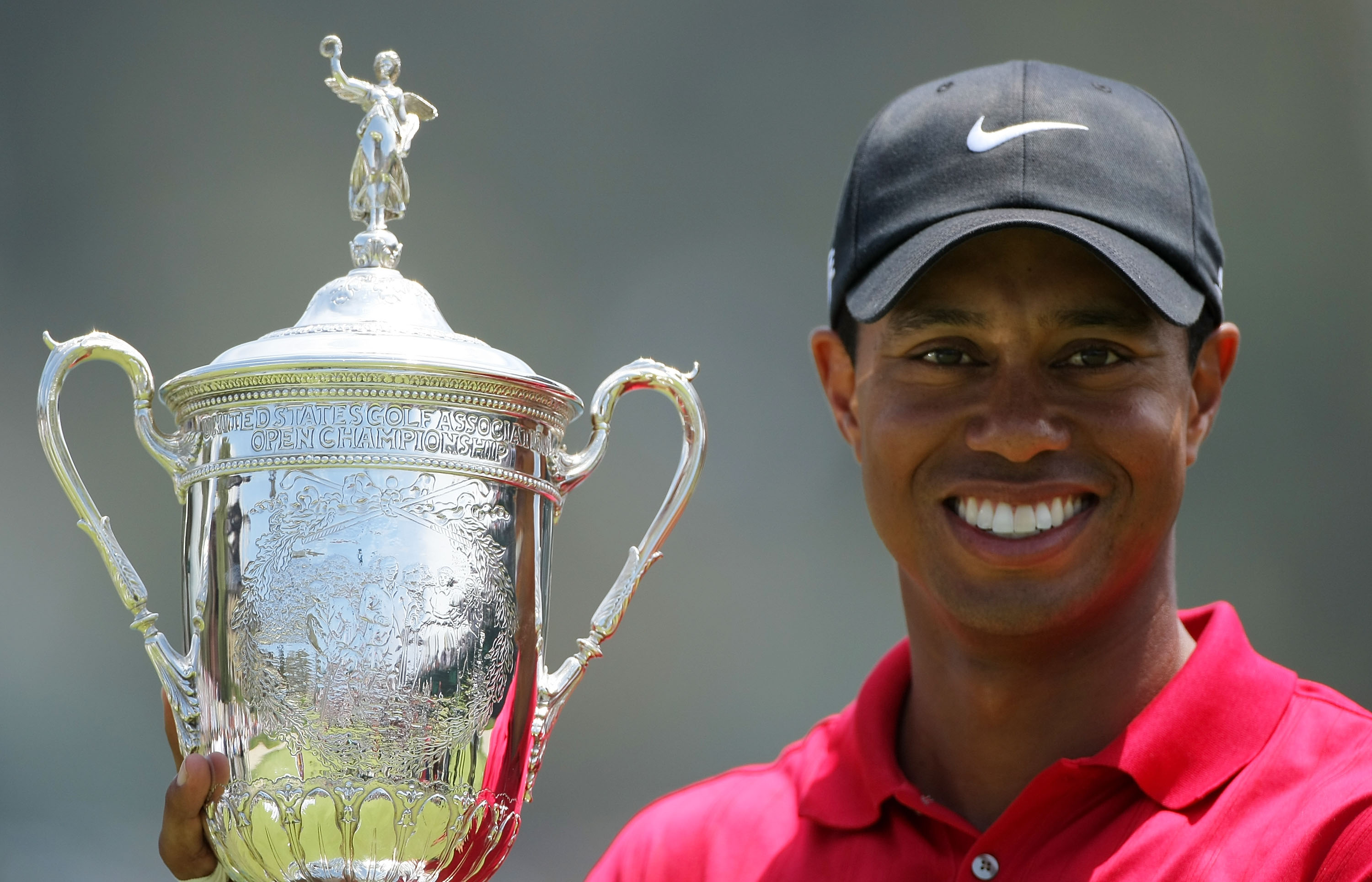 SAN DIEGO - JUNE 16:  Tiger Woods celebrates with the trophy after winning on the first sudden death playoff hole during the playoff round of the 108th U.S. Open at the Torrey Pines Golf Course (South Course) on June 16, 2008 in San Diego, California.  (P