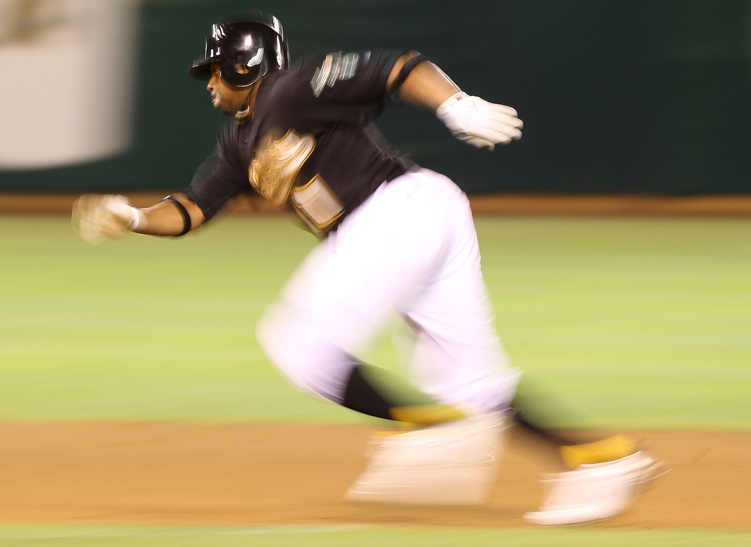 OAKLAND, CA - SEPTEMBER 03:  Rajai Davis #11 of the Oakland Athletics scores on a single by Gabe Gross against the Los Angeles Angels of Anaheim in the seventh inning during a Major League Baseball game at the Oakland-Alameda County Coliseum on September