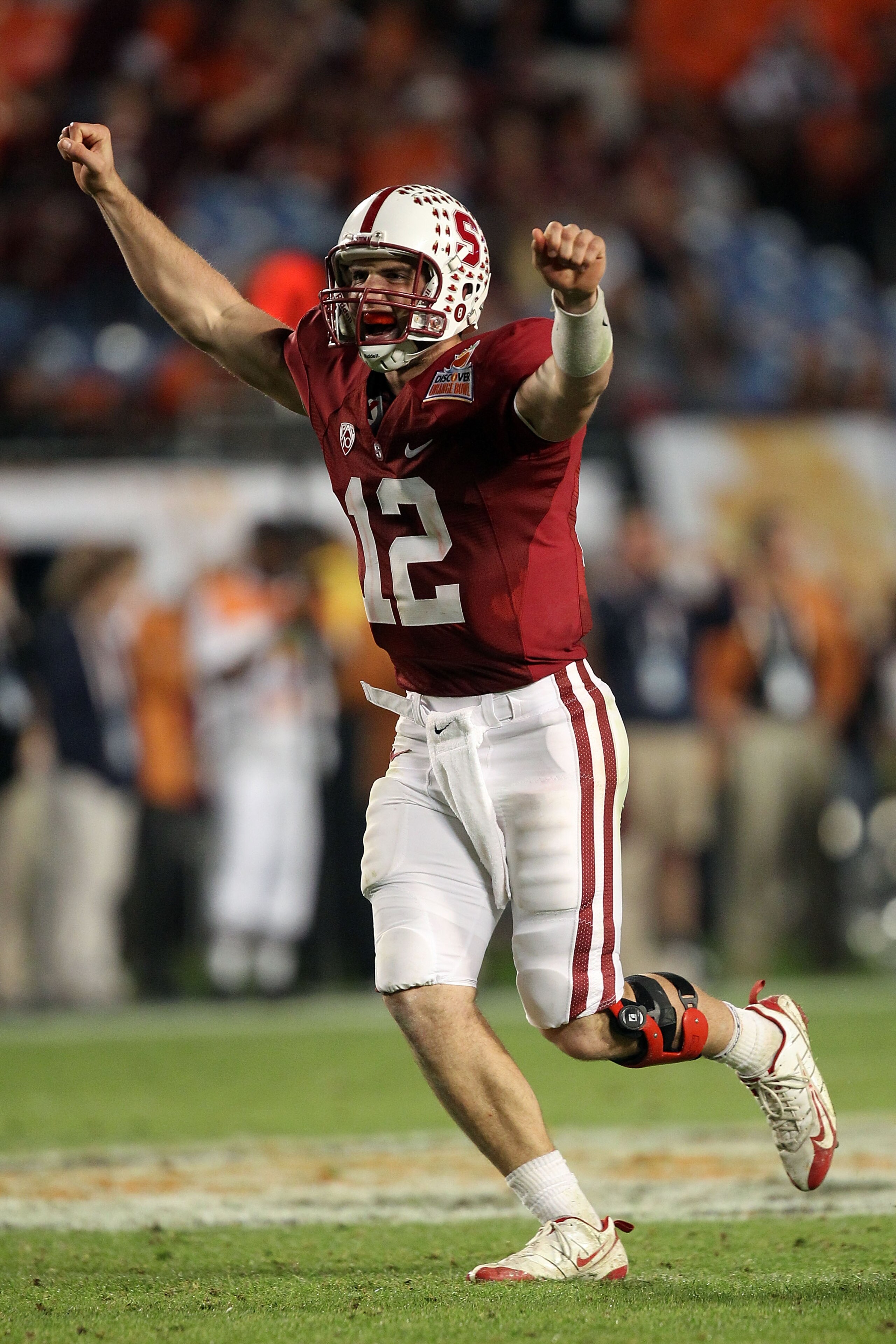 MIAMI, FL - JANUARY 03: Andrew Luck #12 of the Stanford Cardinal celebrates after he threw a 38-yard touchdown pass in the fourth quarter against the Virginia Tech Hokies during the 2011 Discover Orange Bowl at Sun Life Stadium on January 3, 2011 in Miami