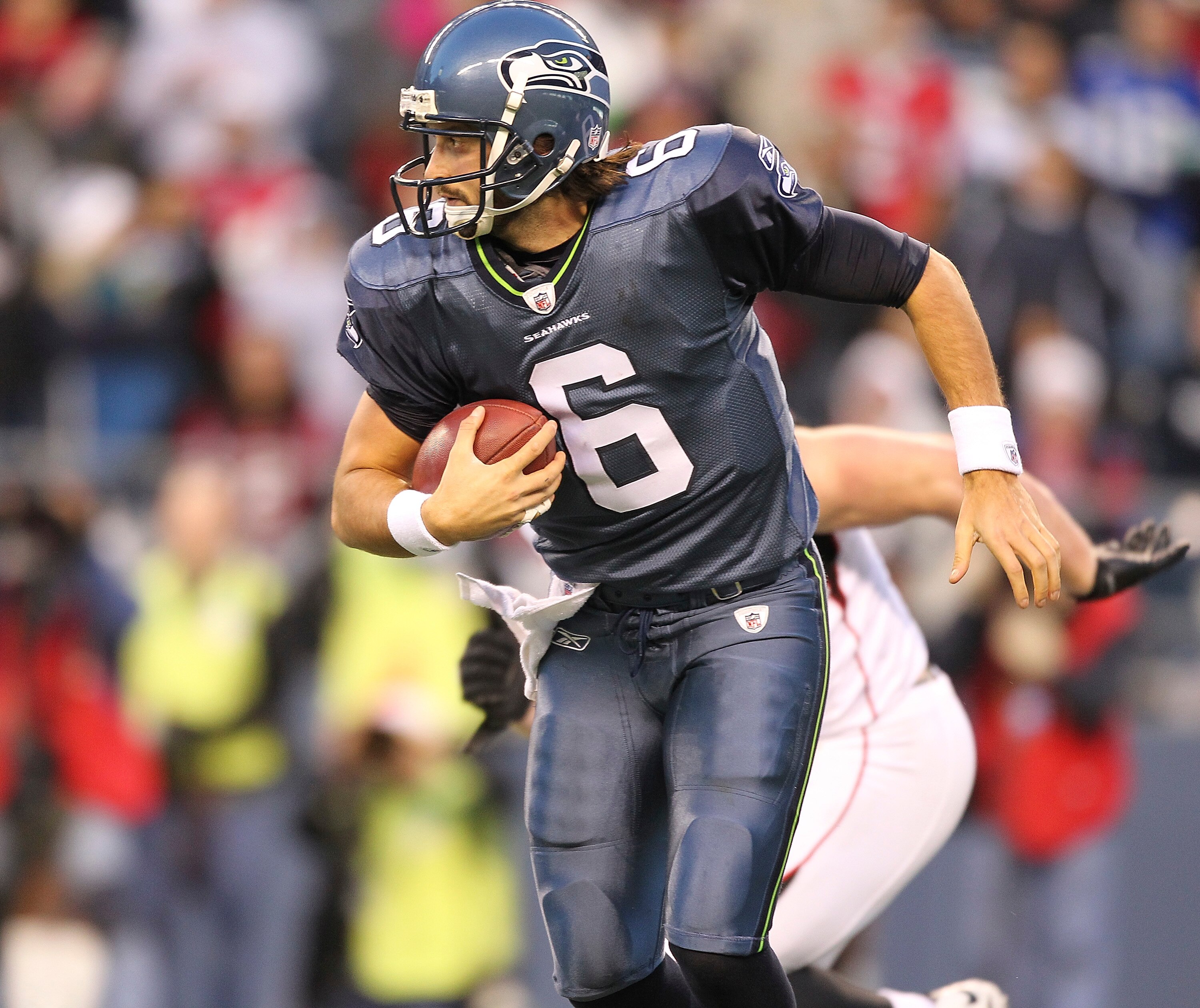 SEATTLE - DECEMBER 19:  Quarterback Charlie Whitehurst #6 of the Seattle Seahawks rushes against the Atlanta Falcons at Qwest Field on December 19, 2010 in Seattle, Washington. The Falcons defeated the Seahawks 34-18. (Photo by Otto Greule Jr/Getty Images
