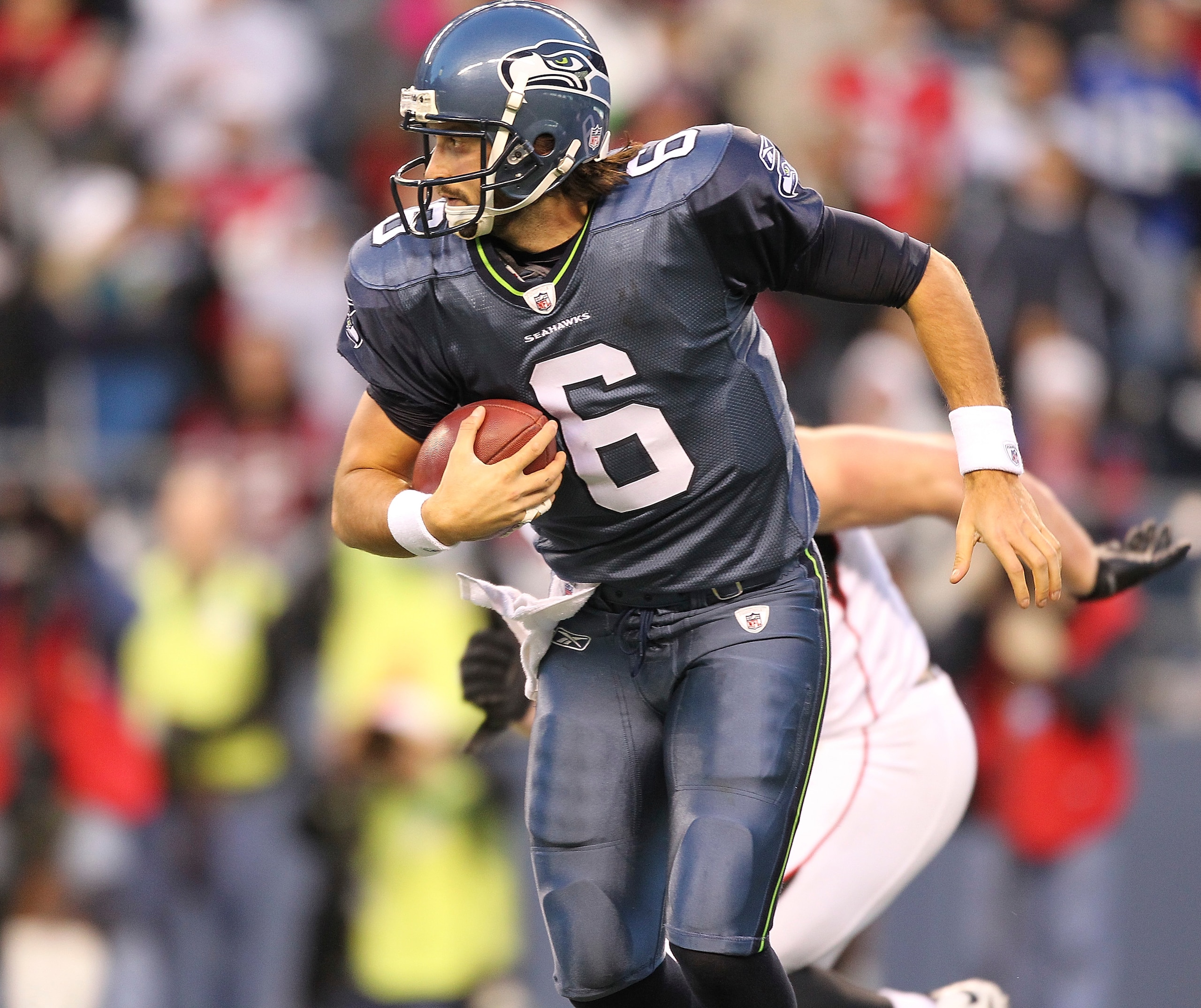 SEATTLE - DECEMBER 19:  Quarterback Charlie Whitehurst #6 of the Seattle Seahawks rushes against the Atlanta Falcons at Qwest Field on December 19, 2010 in Seattle, Washington. The Falcons defeated the Seahawks 34-18. (Photo by Otto Greule Jr/Getty Images
