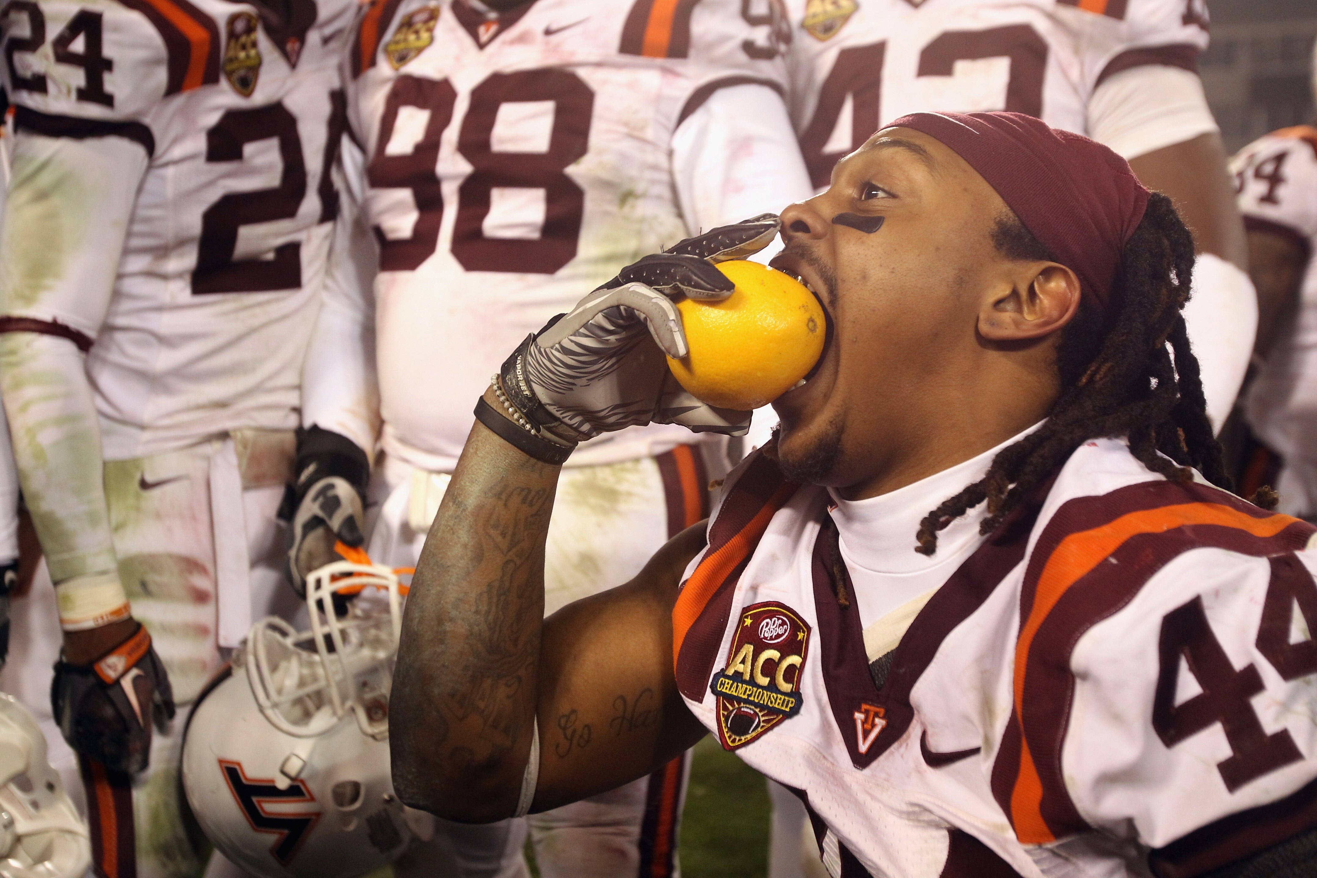 CHARLOTTE, NC - DECEMBER 04:  Lyndell Gibson #44 of the Virginia Tech Hokies celebrates with an orange after defeating the Florida State Seminoles to win the ACC Championship 44-33 at Bank of America Stadium on December 4, 2010 in Charlotte, North Carolin