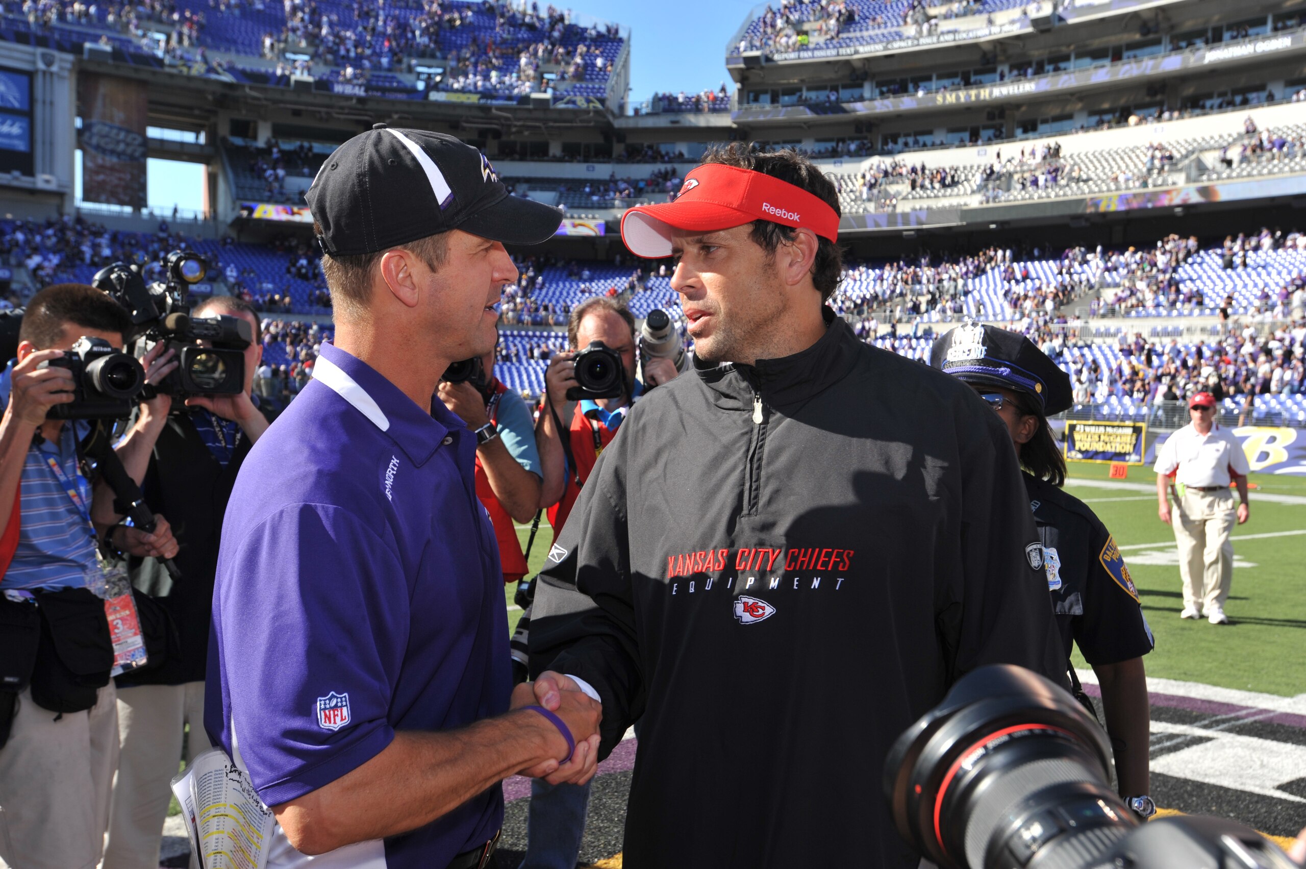 BALTIMORE - SEPTEMBER 13: Head coach John Harbaugh of the Baltimore Ravens shakes hands with head coach Todd Haley of the Kansas City Chiefs after the game at M&T Bank Stadium on September 13, 2009 in Baltimore, Maryland. The Ravens defeated the Chiefs 3 BALTIMORE - SEPTEMBER 13: Head coach John Harbaugh of the Baltimore Ravens shakes hands with head coach Todd Haley of the Kansas City Chiefs after the game at M&T Bank Stadium on September 13, 2009 in Baltimore, Maryland. The Ravens defeated the Chiefs 3