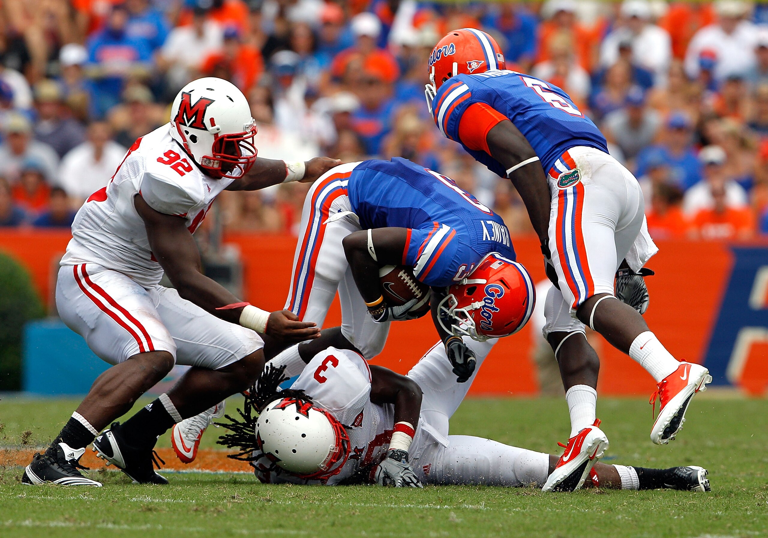 GAINESVILLE, FL - SEPTEMBER 04: Receiver Chris Rainey #3 of the Florida Gators attempts to run past Dayonne Nunley #3 of the Miami University RedHawks at Ben Hill Griffin Stadium on September 4, 2010 in Gainesville, Florida. (Photo by Sam Greenwood/Gett GAINESVILLE, FL - SEPTEMBER 04: Receiver Chris Rainey #3 of the Florida Gators attempts to run past Dayonne Nunley #3 of the Miami University RedHawks at Ben Hill Griffin Stadium on September 4, 2010 in Gainesville, Florida. (Photo by Sam Greenwood/Gett