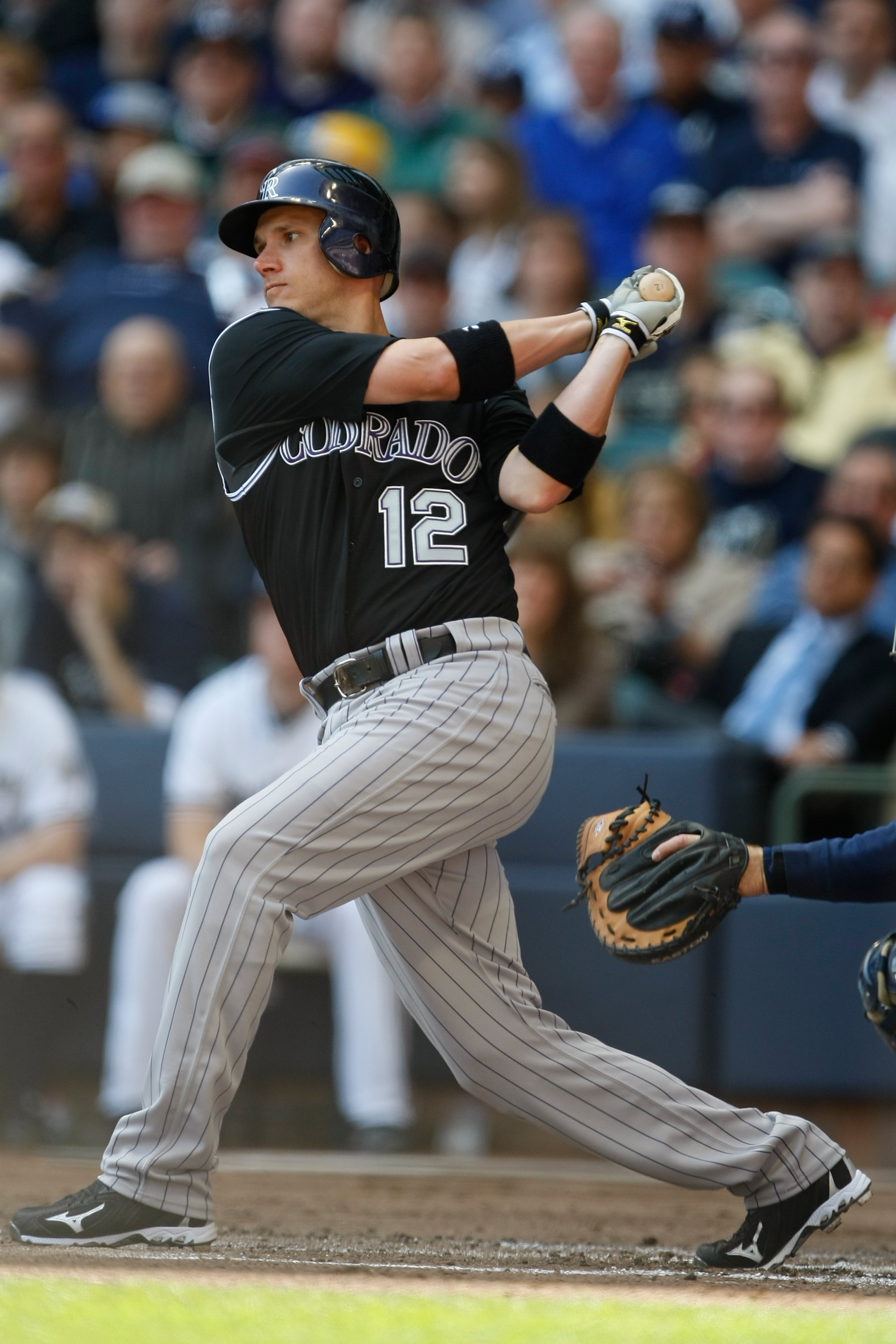 MILWAUKEE, WI - APRIL 05: Second baseman Clint Barnes #12 of the Colorado Rockies follows through on his swing against the Milwaukee Brewers at the Miller Park on April 05, 2010 in Milwaukee, Wisconsin. The Rockies defeated the Brewers 5-3.(Photo by Scott