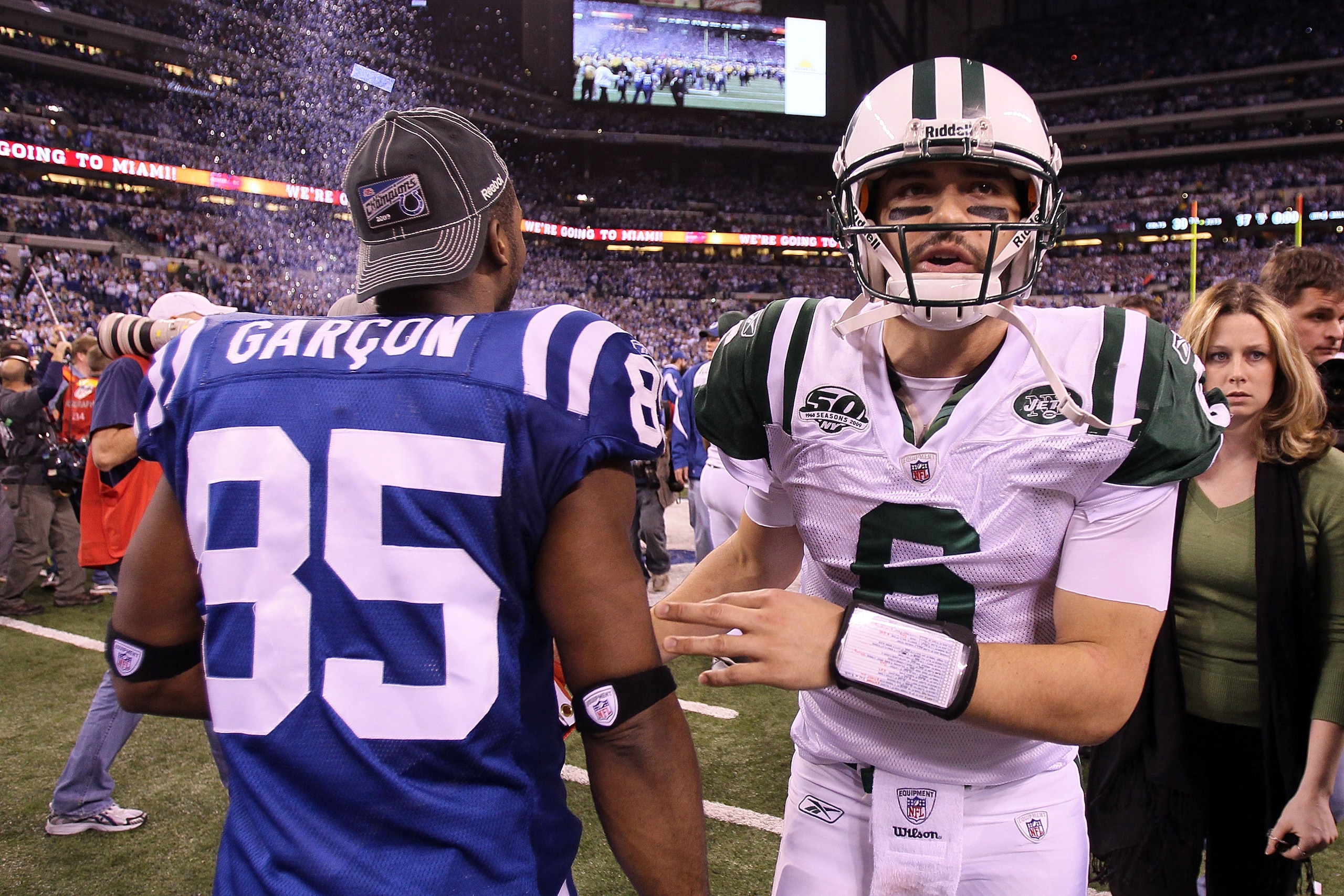 INDIANAPOLIS - JANUARY 24: Quarterback Mark Sanchez #6 of the New York Jets walks by Pierre Garcon #85 of the Indianapolis Colts after the Jets lost to the Colts 30-17 in the AFC Championship Game at Lucas Oil Stadium on January 24, 2010 in Indianapolis, INDIANAPOLIS - JANUARY 24: Quarterback Mark Sanchez #6 of the New York Jets walks by Pierre Garcon #85 of the Indianapolis Colts after the Jets lost to the Colts 30-17 in the AFC Championship Game at Lucas Oil Stadium on January 24, 2010 in Indianapolis,