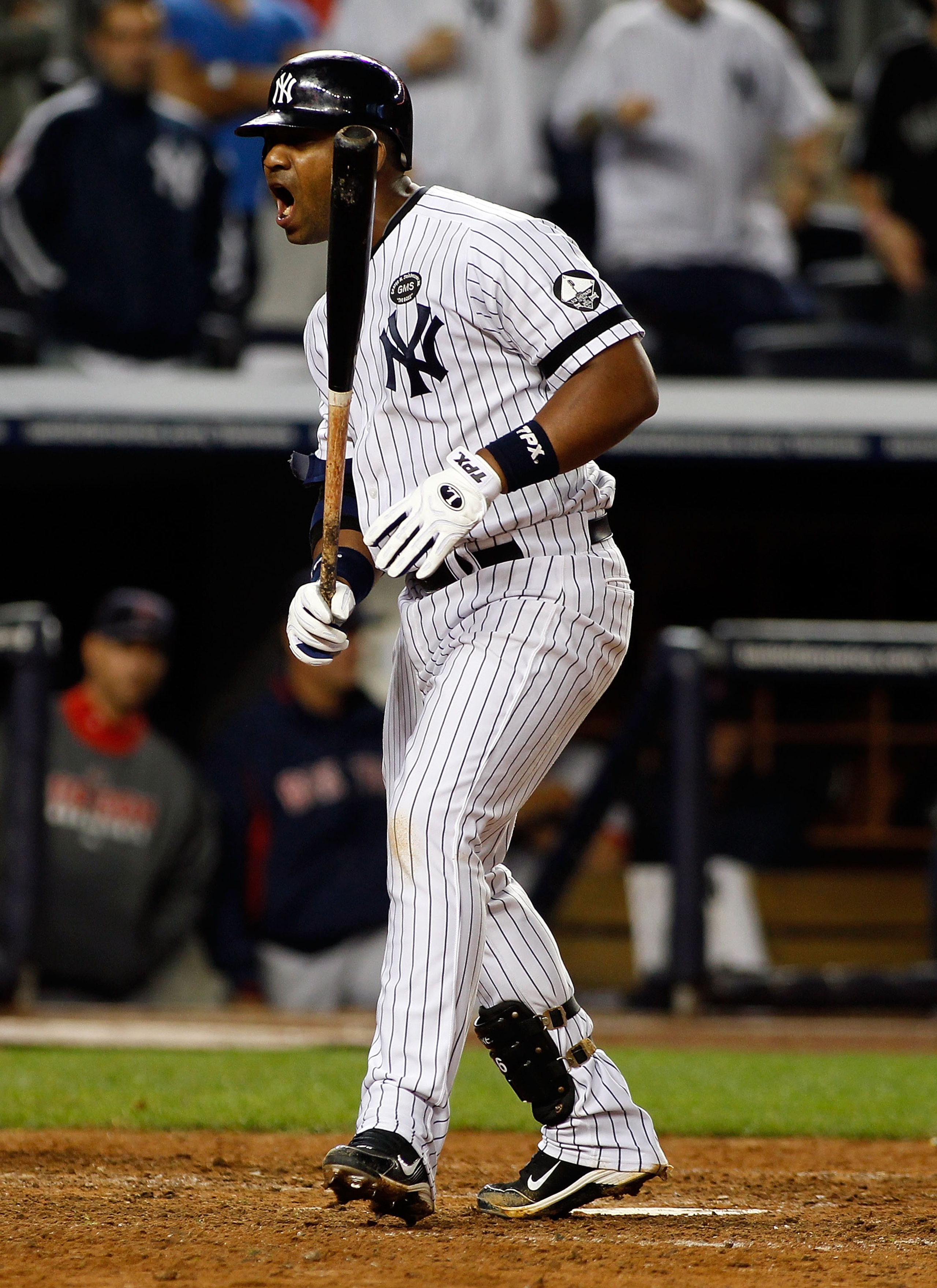 NEW YORK - SEPTEMBER 26:  Juan Miranda #53 of the New York Yankees celebrates after walking with the base loaded to force in the game winning run in the 10th inning against the Boston Red Sox on September 26, 2010 at Yankee Stadium in the Bronx borough of