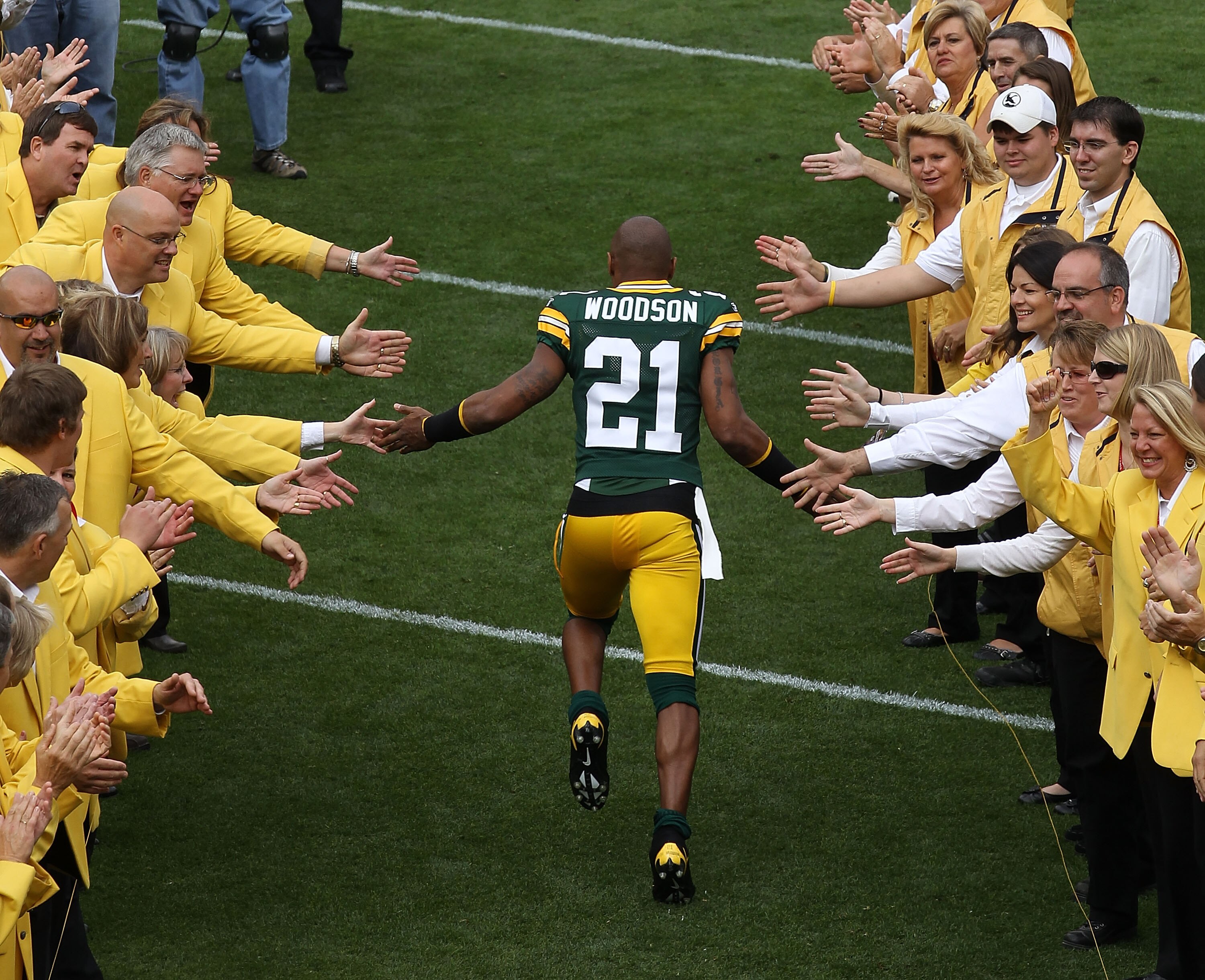 GREEN BAY, WI - SEPTEMBER 19: Charles Woodson #21 of the Green Bay Packers runs onto the field during player introductions before a game against the Buffalo Bills at Lambeau Field on September 19, 2010 in Green Bay, Wisconsin. (Photo by Jonathan Daniel/Ge