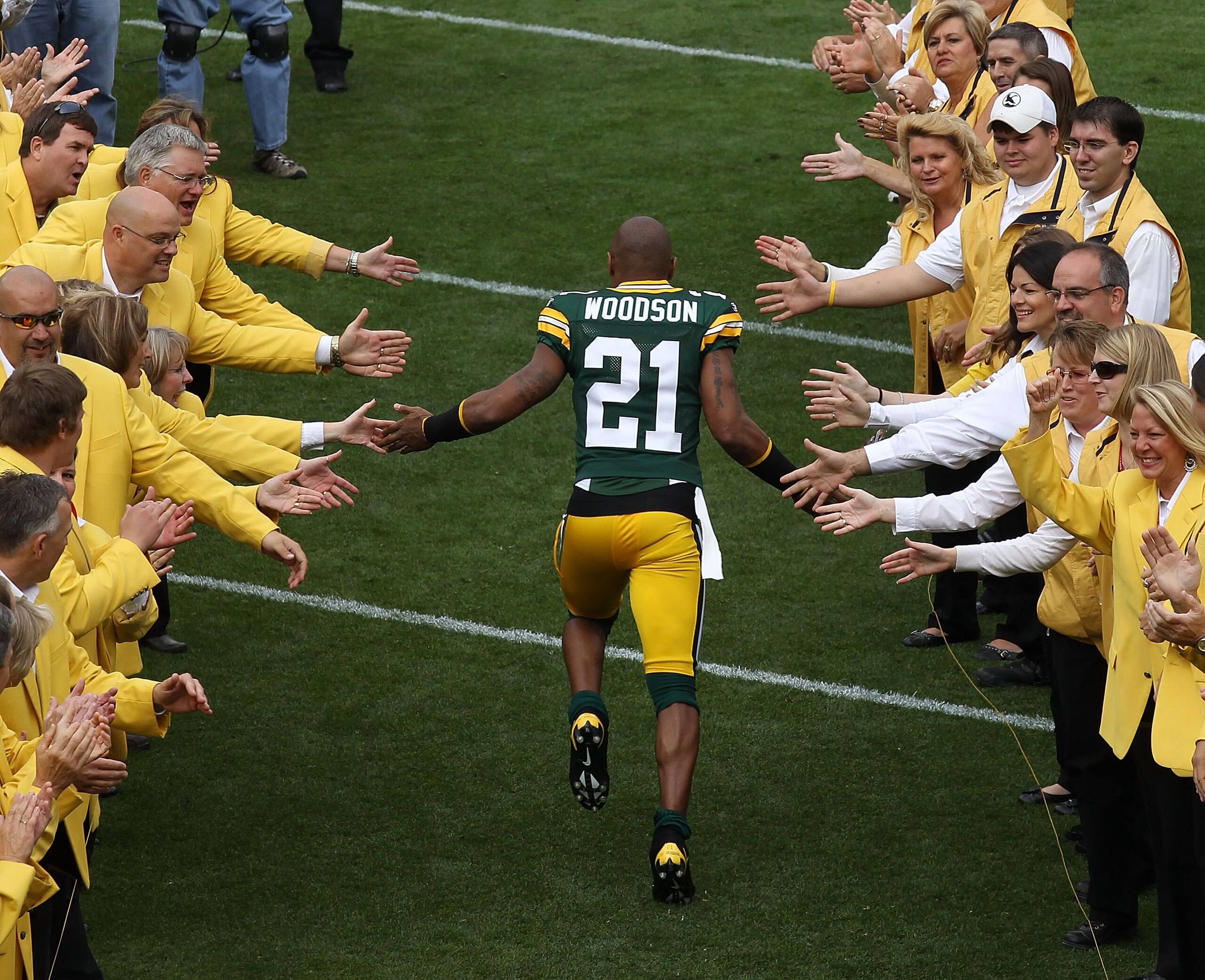 GREEN BAY, WI - SEPTEMBER 19: Charles Woodson #21 of the Green Bay Packers runs onto the field during player introductions before a game against the Buffalo Bills at Lambeau Field on September 19, 2010 in Green Bay, Wisconsin. (Photo by Jonathan Daniel/Ge