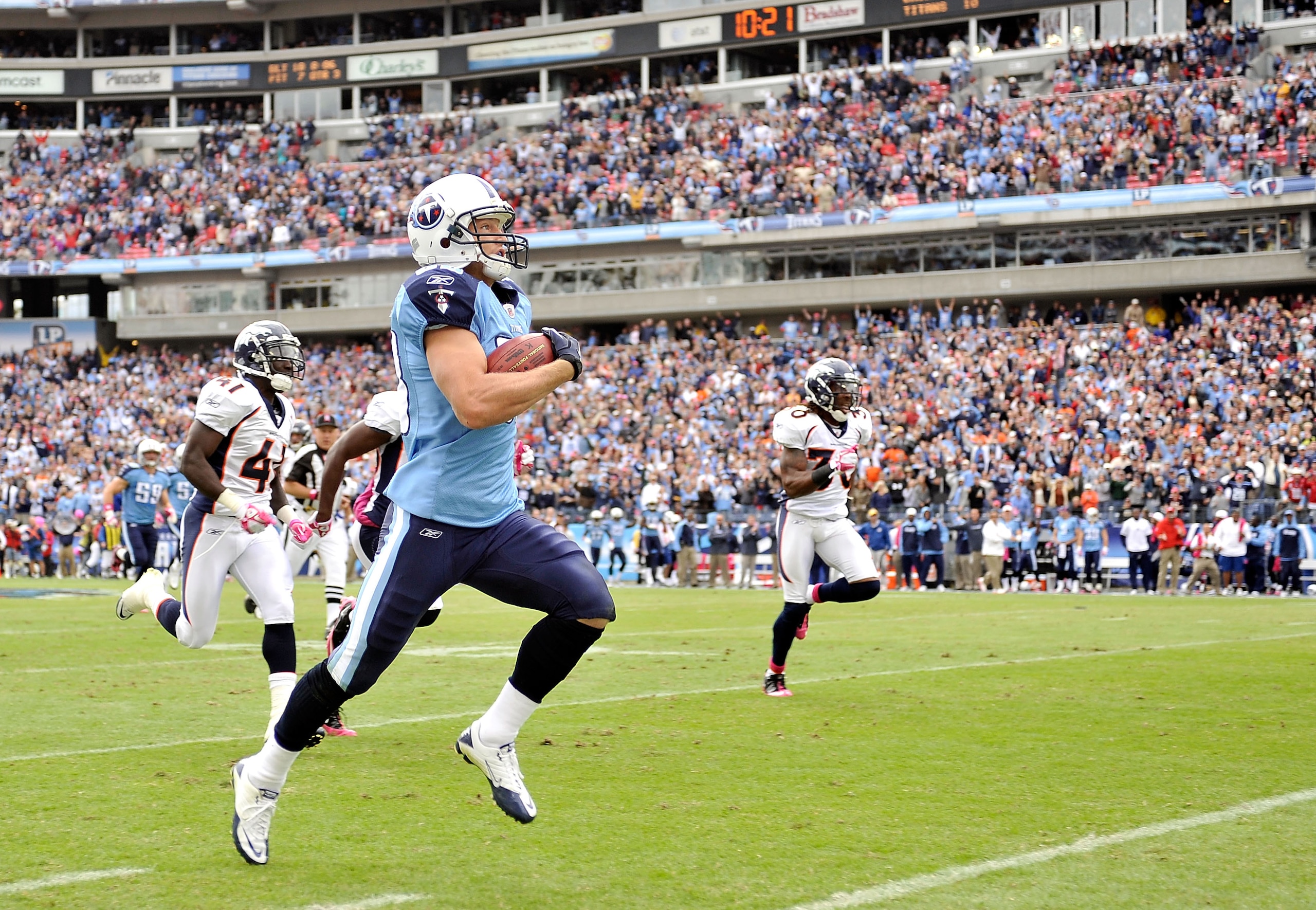 NASHVILLE, TN - OCTOBER 03:  Marc Mariani #83 of the Tennessee Titans runs a kickoff back for a touchdown aganst the Denver Broncos at LP Field on October 3, 2010 in Nashville, Tennessee. Denver won 26-20.  (Photo by Grant Halverson/Getty Images)