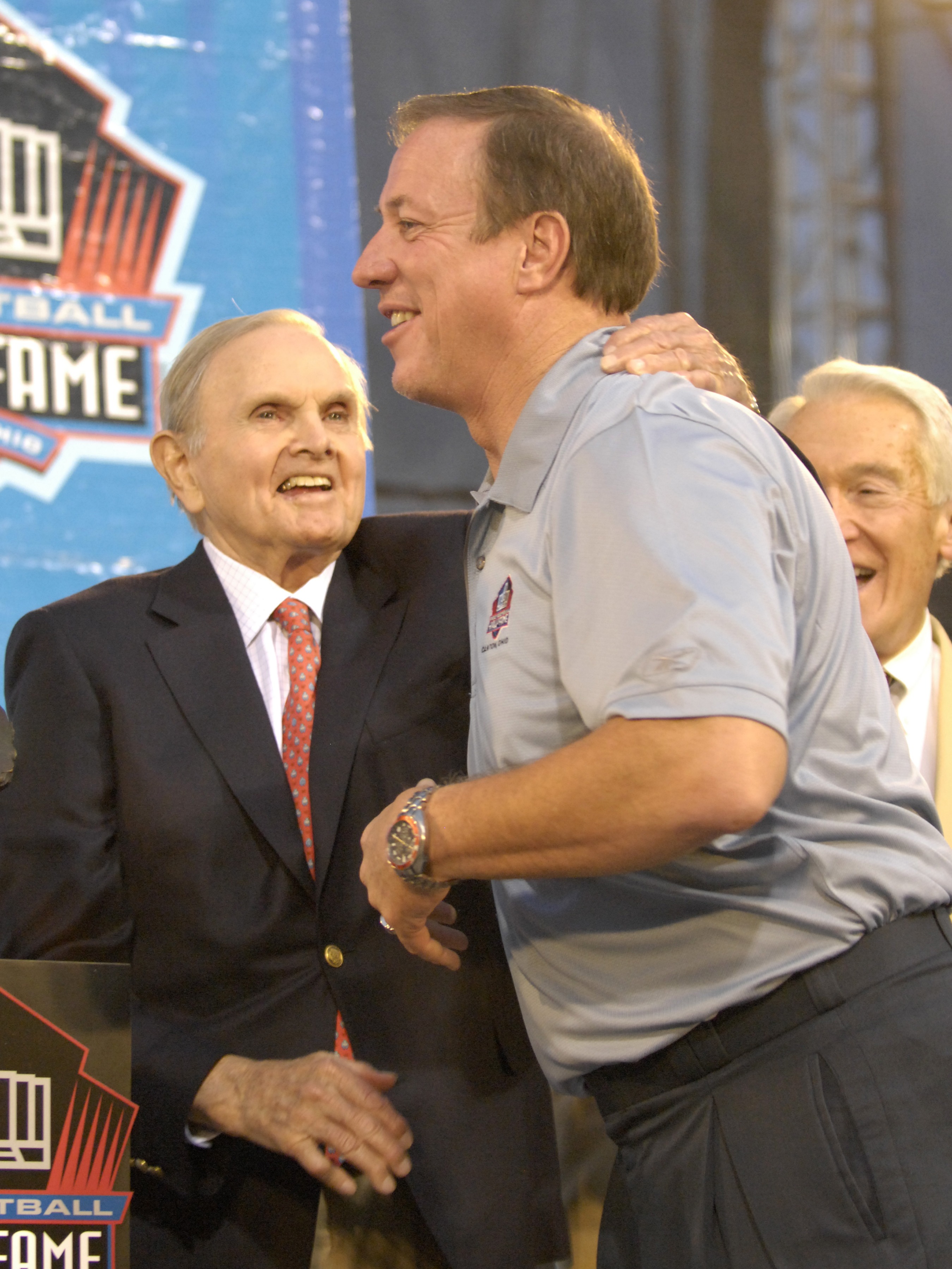 CANTON, OH - AUGUST 04:  Buffalo Bills owner Ralph Wilson (L) and retired quarterback Jim Kelly hug during the Class of 2007 Pro Football Hall of Fame Enshrinement Ceremony August 4, 2007 in Canton, Ohio. (Photo by Al Messerschmidt/Getty Images)
