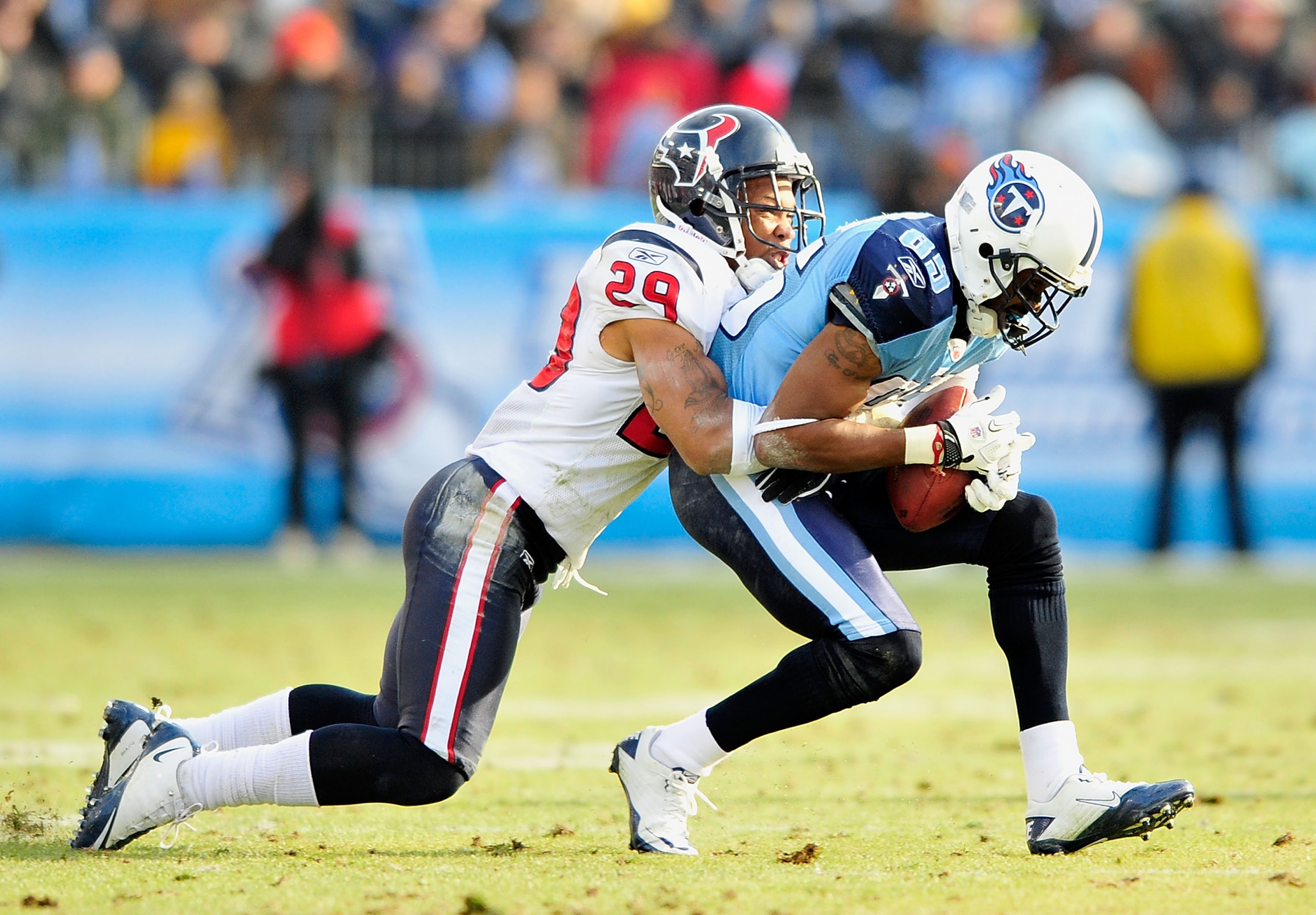 NASHVILLE, TN - DECEMBER 19:  Nate Washington #85 of the Tennessee Titans makes a catch under pressure from Glover Quin #29 of the Houston Texans at LP Field on December 19, 2010 in Nashville, Tennessee. The Titans defeated the Texans, 31-17.  (Photo by G