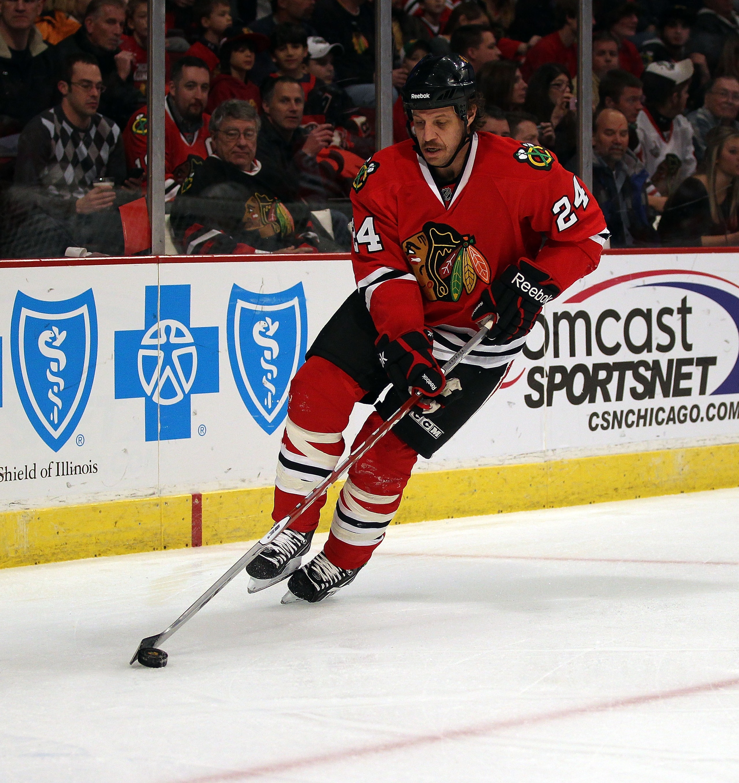 CHICAGO, IL - DECEMBER 03: Nick Boynton #24 of the Chicago Blackhawks controls the puck against the Vancouver Canucks at the United Center on December 3, 2010 in Chicago, Illinois. The Canucks defeated the Blackhawks 3-0. (Photo by Jonathan Daniel/Getty I CHICAGO, IL - DECEMBER 03: Nick Boynton #24 of the Chicago Blackhawks controls the puck against the Vancouver Canucks at the United Center on December 3, 2010 in Chicago, Illinois. The Canucks defeated the Blackhawks 3-0. (Photo by Jonathan Daniel/Getty I