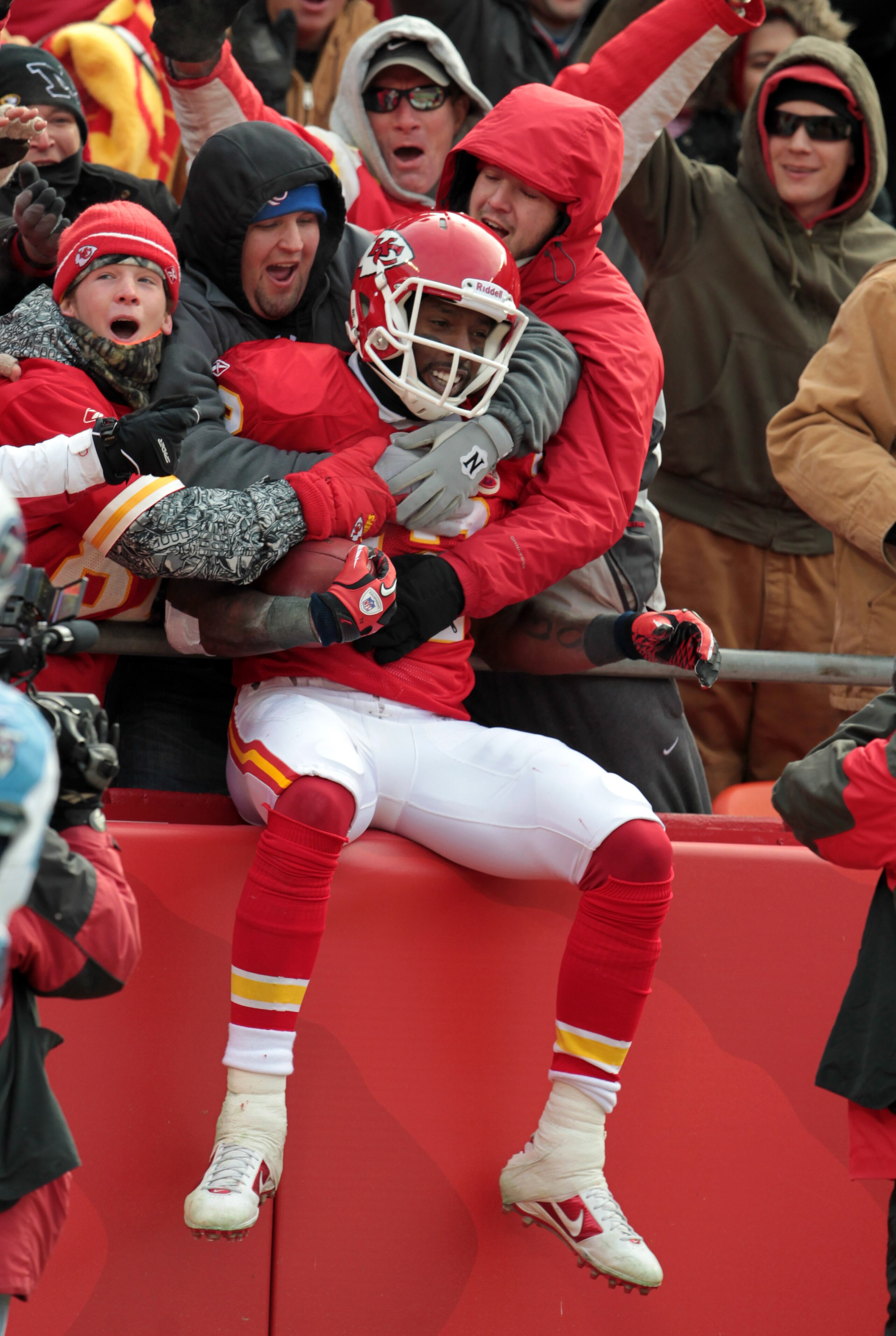 KANSAS CITY, MO - DECEMBER 26: Receiver Dwayne Bowe #82 of the Kansas City Chiefs is congratulated by fans as he jumps into the stands after making a 75 yard touchdown catch during the game against the Tennessee Titans on December 26, 2010 at Arrowhead S KANSAS CITY, MO - DECEMBER 26: Receiver Dwayne Bowe #82 of the Kansas City Chiefs is congratulated by fans as he jumps into the stands after making a 75 yard touchdown catch during the game against the Tennessee Titans on December 26, 2010 at Arrowhead S