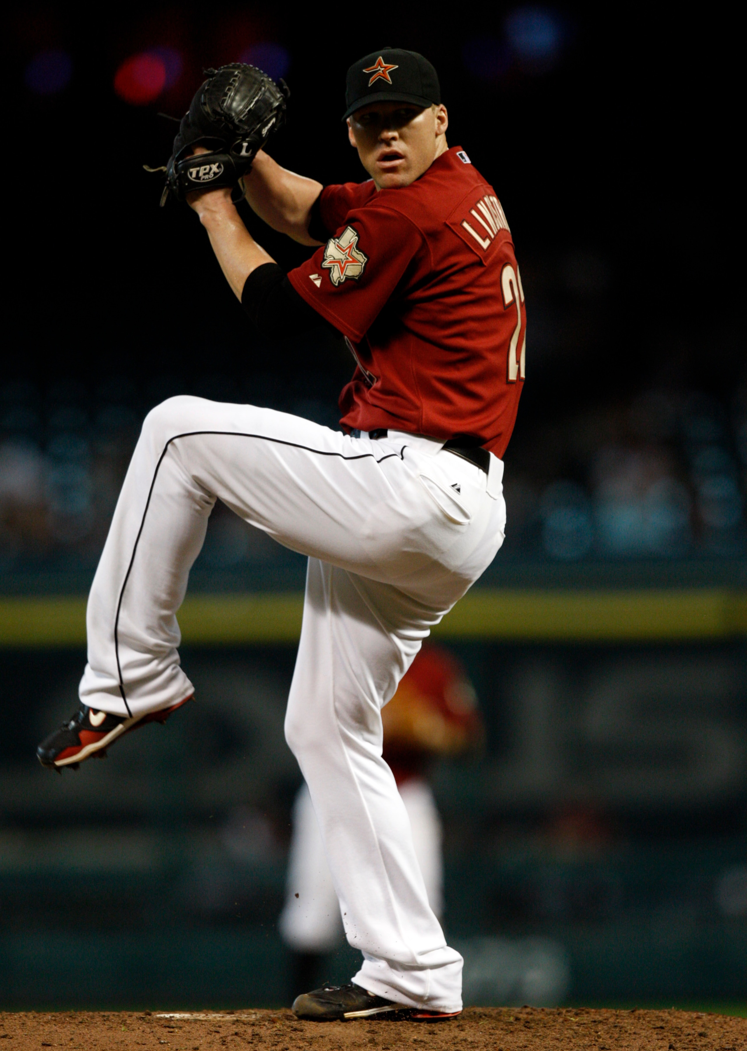 HOUSTON - SEPTEMBER 19:  Pitcher Matt Lindstrom #22 of the Houston Astros throws in the eighth inning against the Cincinnatti Reds at Minute Maid Park on September 19, 2010 in Houston, Texas.  (Photo by Bob Levey/Getty Images)