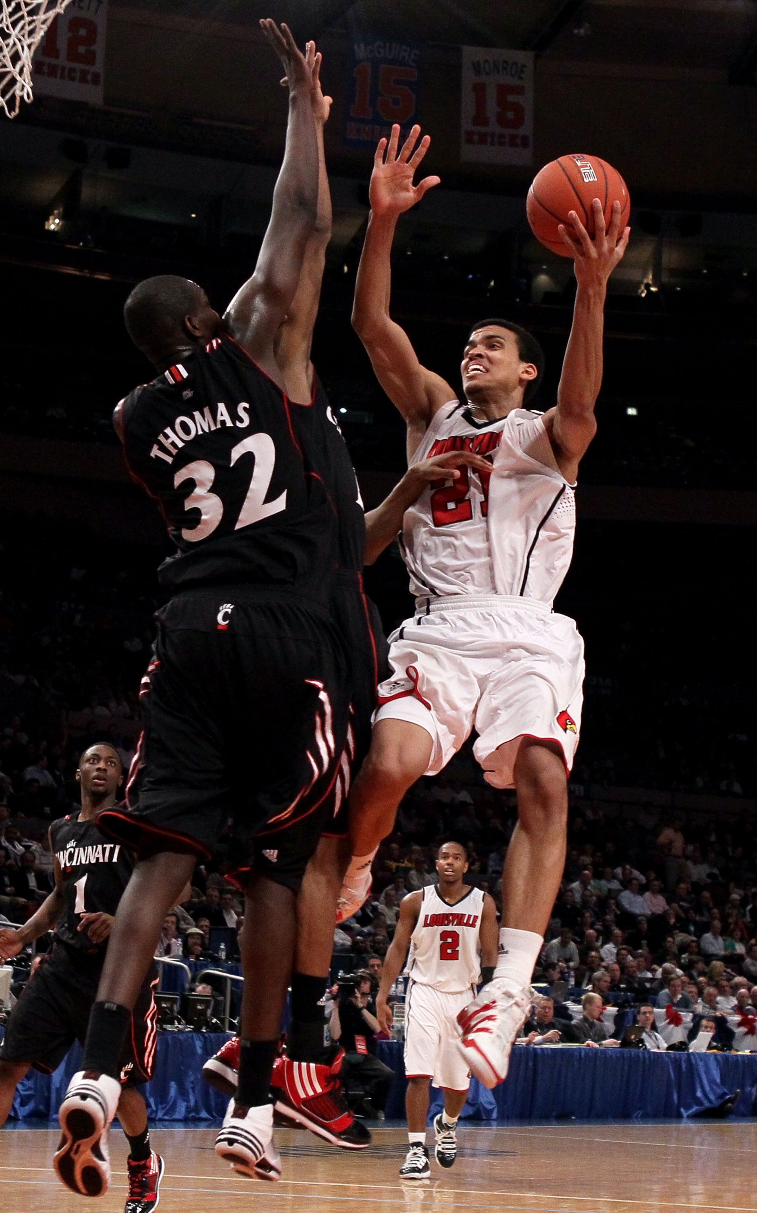 NEW YORK - MARCH 10: Jared Swopshire #21 of the Louisville Cardinals goes to the hoop against Ibrahima Thomas #32 of the Cincinnati Bearcats during the second round of 2010 NCAA Big East Tournament at Madison Square Garden on March 10, 2010 in New York Ci NEW YORK - MARCH 10: Jared Swopshire #21 of the Louisville Cardinals goes to the hoop against Ibrahima Thomas #32 of the Cincinnati Bearcats during the second round of 2010 NCAA Big East Tournament at Madison Square Garden on March 10, 2010 in New York Ci