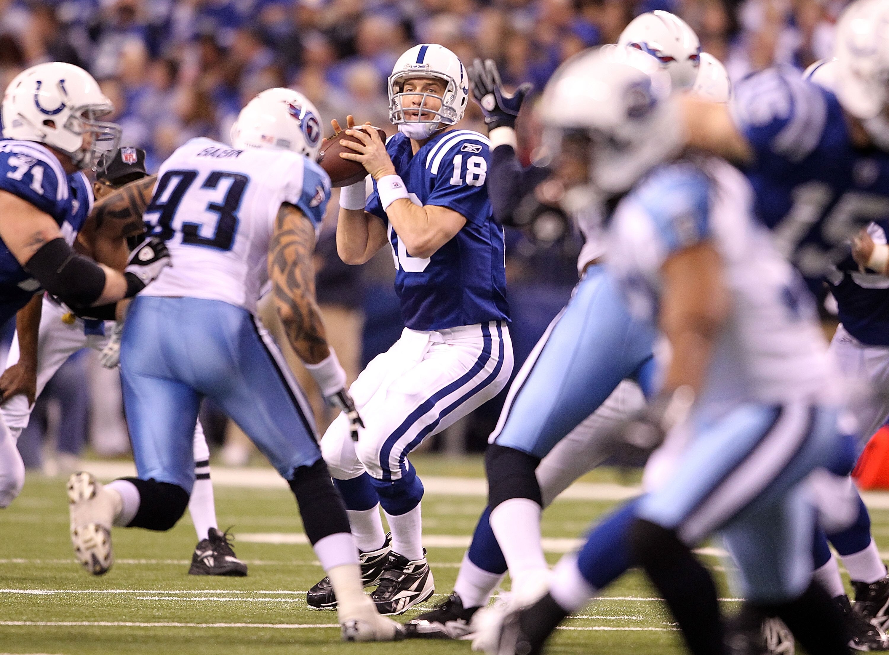 INDIANAPOLIS - JANUARY 02:  Peyton Manning #18 of the Indianapolis Colts looks to pass the ball during NFL game against the Tennessee Titans at Lucas Oil Stadium on January 2, 2011 in Indianapolis, Indiana.  (Photo by Andy Lyons/Getty Images)