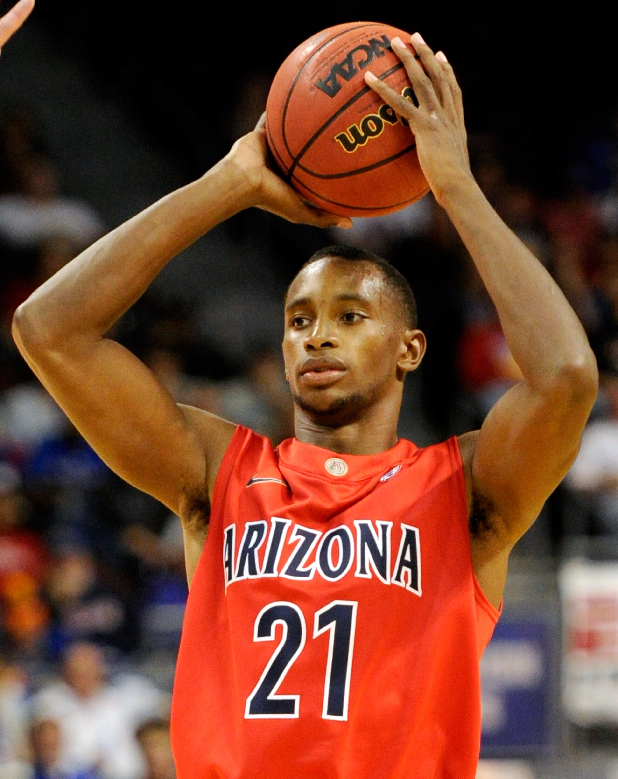 LAS VEGAS - NOVEMBER 27:  Kyle Fogg #21 of the Arizona Wildcats looks to pass against the Kansas Jayhawks during the championship game of the Las Vegas Invitational at The Orleans Arena November 27, 2010 in Las Vegas, Nevada. Kansas won 87-79.  (Photo by