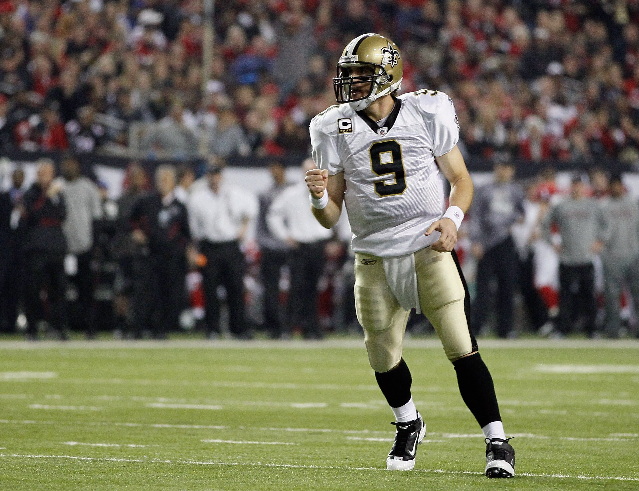 ATLANTA, GA - DECEMBER 27: Quarterback Drew Brees #9 of the New Orleans Saints celebrates a touchdown pass in the first half during the game against the Atlanta Falcons at the Georgia Dome on December 27, 2010 in Atlanta, Georgia. (Photo by Kevin C. Cox ATLANTA, GA - DECEMBER 27: Quarterback Drew Brees #9 of the New Orleans Saints celebrates a touchdown pass in the first half during the game against the Atlanta Falcons at the Georgia Dome on December 27, 2010 in Atlanta, Georgia. (Photo by Kevin C. Cox