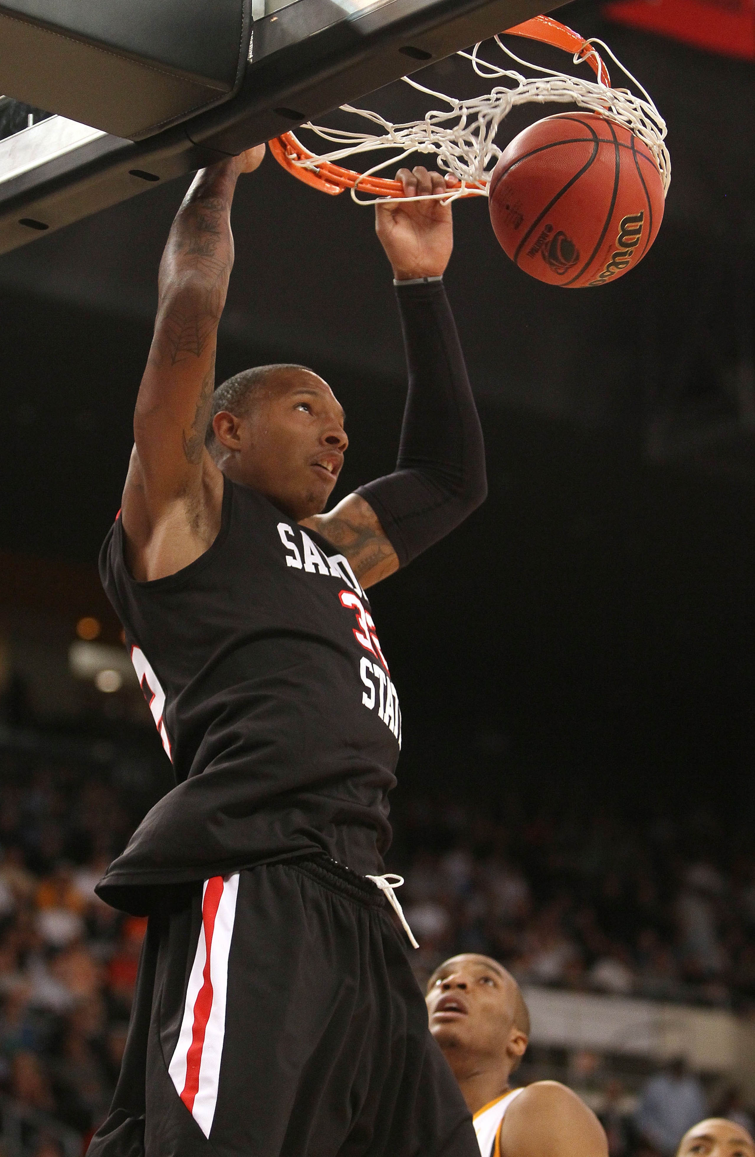 PROVIDENCE, RI - MARCH 18: Billy White #32 of the San Diego State Aztecs dunks the ball in the first half against the Tennessee Volunteers during the first round of the 2010 NCAA men's basketball tournament on March 18, 2010 at the Dunkin Donuts Arena in PROVIDENCE, RI - MARCH 18: Billy White #32 of the San Diego State Aztecs dunks the ball in the first half against the Tennessee Volunteers during the first round of the 2010 NCAA men's basketball tournament on March 18, 2010 at the Dunkin Donuts Arena in