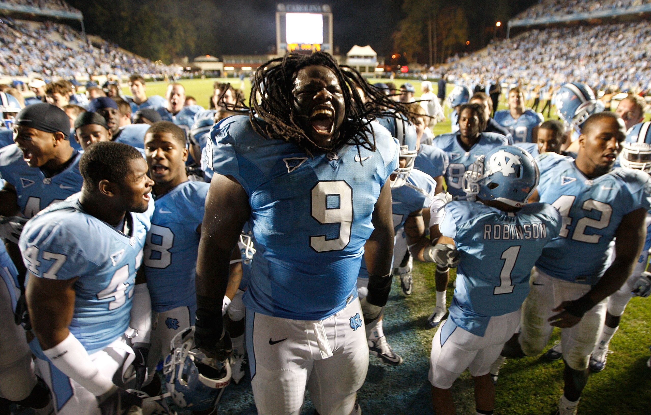 CHAPEL HILL, NC - NOVEMBER 07:  Marvin Austin #9 of the North Carolina Tar Heels celebrates with teammates after a 19-6 victory over the Duke Blue Devils during their game at Kenan Stadium on November 7, 2009 in Chapel Hill, North Carolina.  (Photo by Str