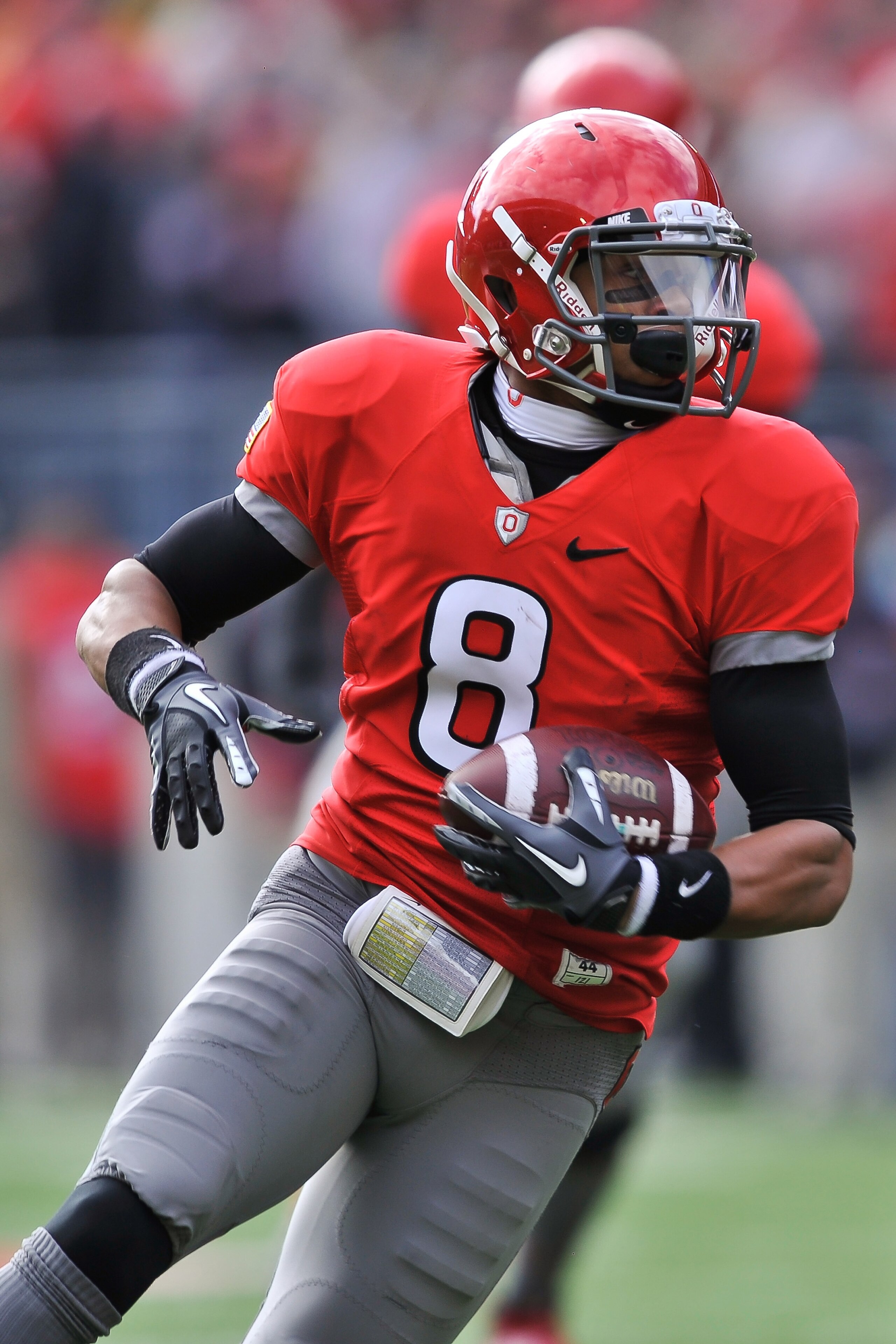 COLUMBUS, OH - NOVEMBER 27:  DeVier Posey #8 of the Ohio State Buckeyes runs with the ball after a pass reception against the Michigan Wolverines at Ohio Stadium on November 27, 2010 in Columbus, Ohio.  (Photo by Jamie Sabau/Getty Images)