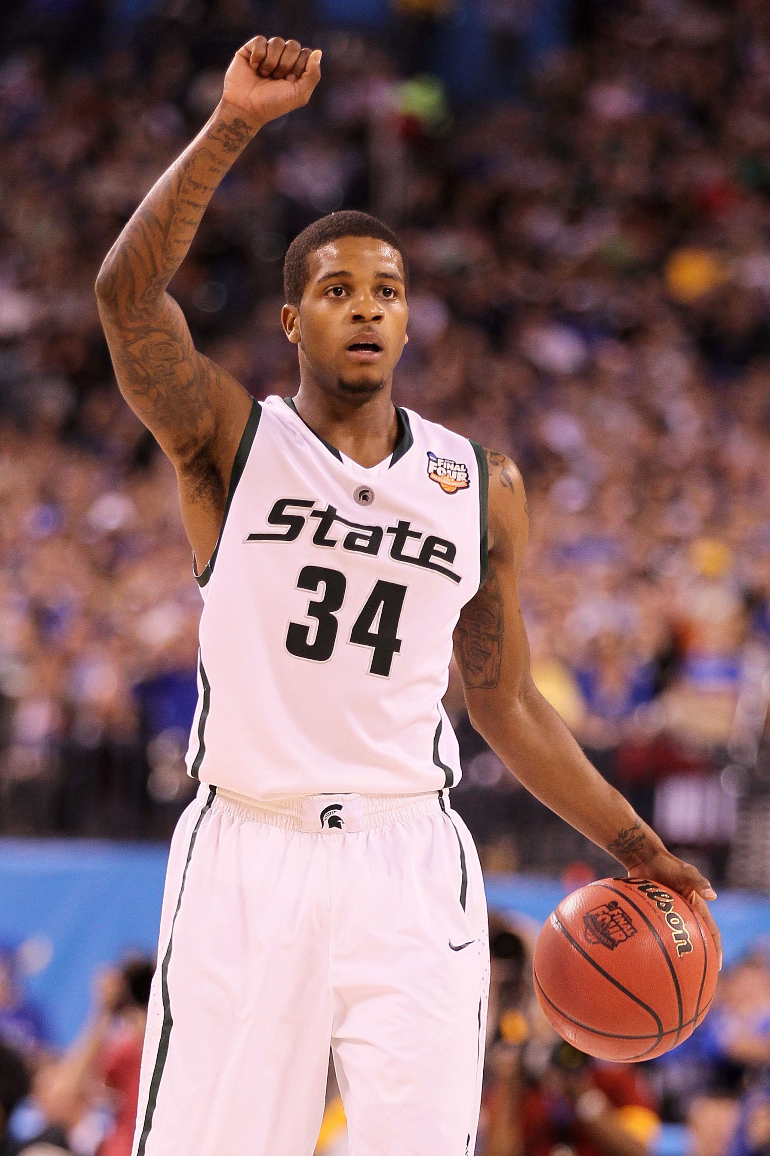INDIANAPOLIS - APRIL 03: Korie Lucious #34 of the Michigan State Spartans with the ball against the Butler Bulldogs during the National Semifinal game of the 2010 NCAA Division I Men's Basketball Championship on April 3, 2010 in Indianapolis, Indiana. ( INDIANAPOLIS - APRIL 03: Korie Lucious #34 of the Michigan State Spartans with the ball against the Butler Bulldogs during the National Semifinal game of the 2010 NCAA Division I Men's Basketball Championship on April 3, 2010 in Indianapolis, Indiana. (
